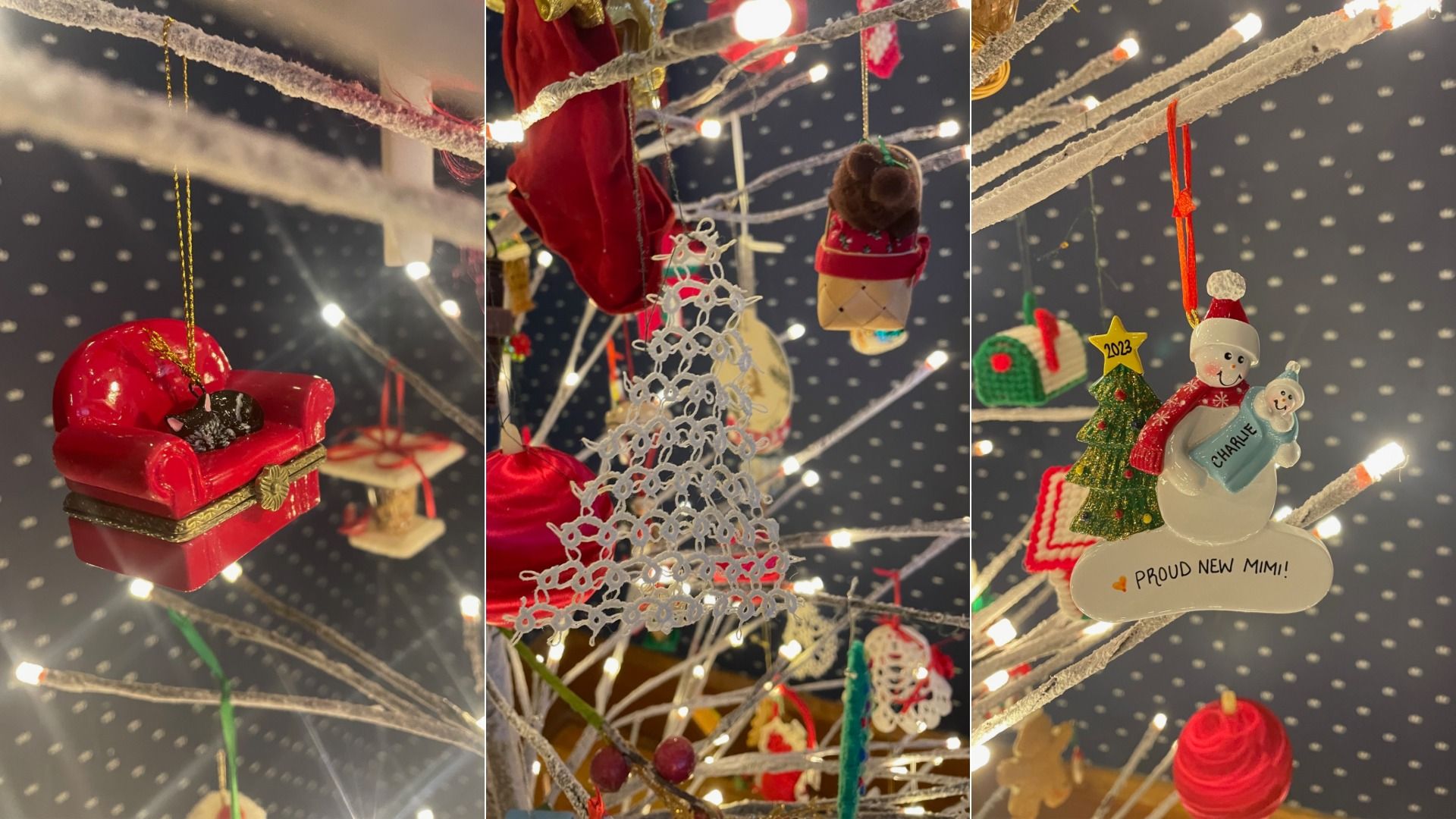 Close-up of various Christmas tree ornaments including a black cat on a red couch, a white crocheted bell, and a snowman ornament saying "Charlie Proud New Mimi!" with 2023 star, on white lighted branches.