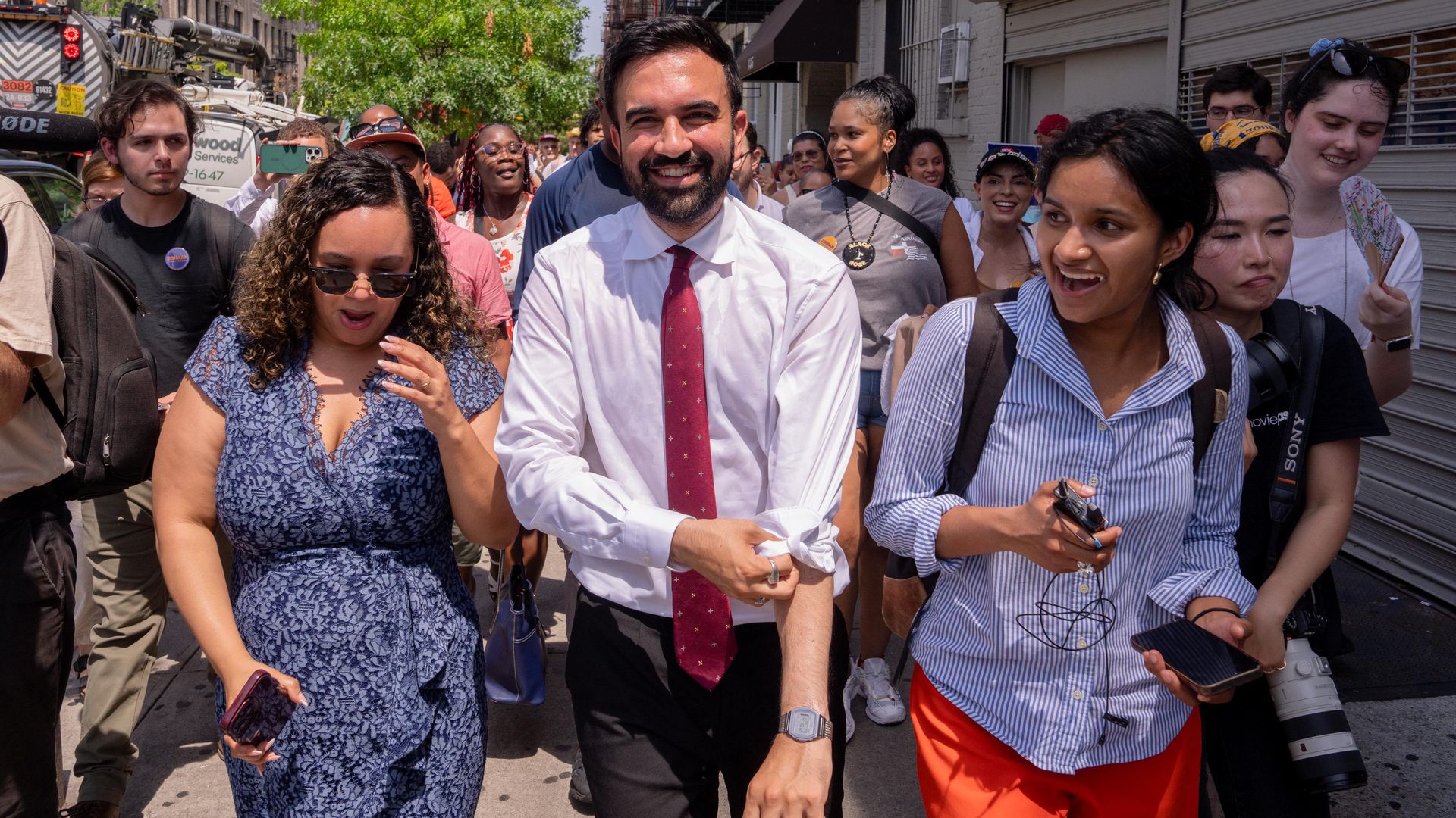 Zohran Mamdani rolls up his sleeves while campaigning in  Manhattan yesterday.