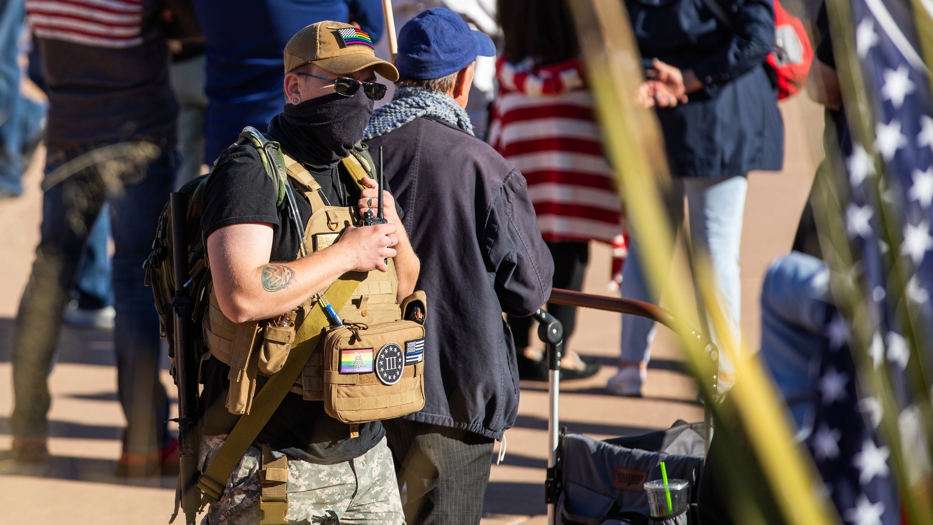 A person wearing a tactical vest with a Three Percenters patch at a Trump rally in Phoenix on Jan. 6, 2021.
