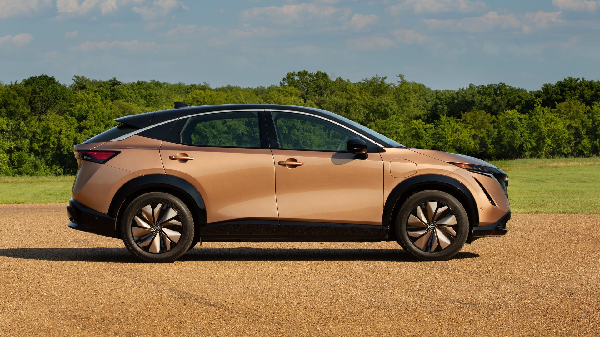 Image of a copper-colored Nissan Ariya electric crossover, going on sale in December 2022