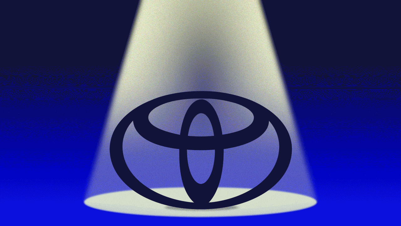 Animated illustration of a Toyota logo in a spotlight which fades in and out