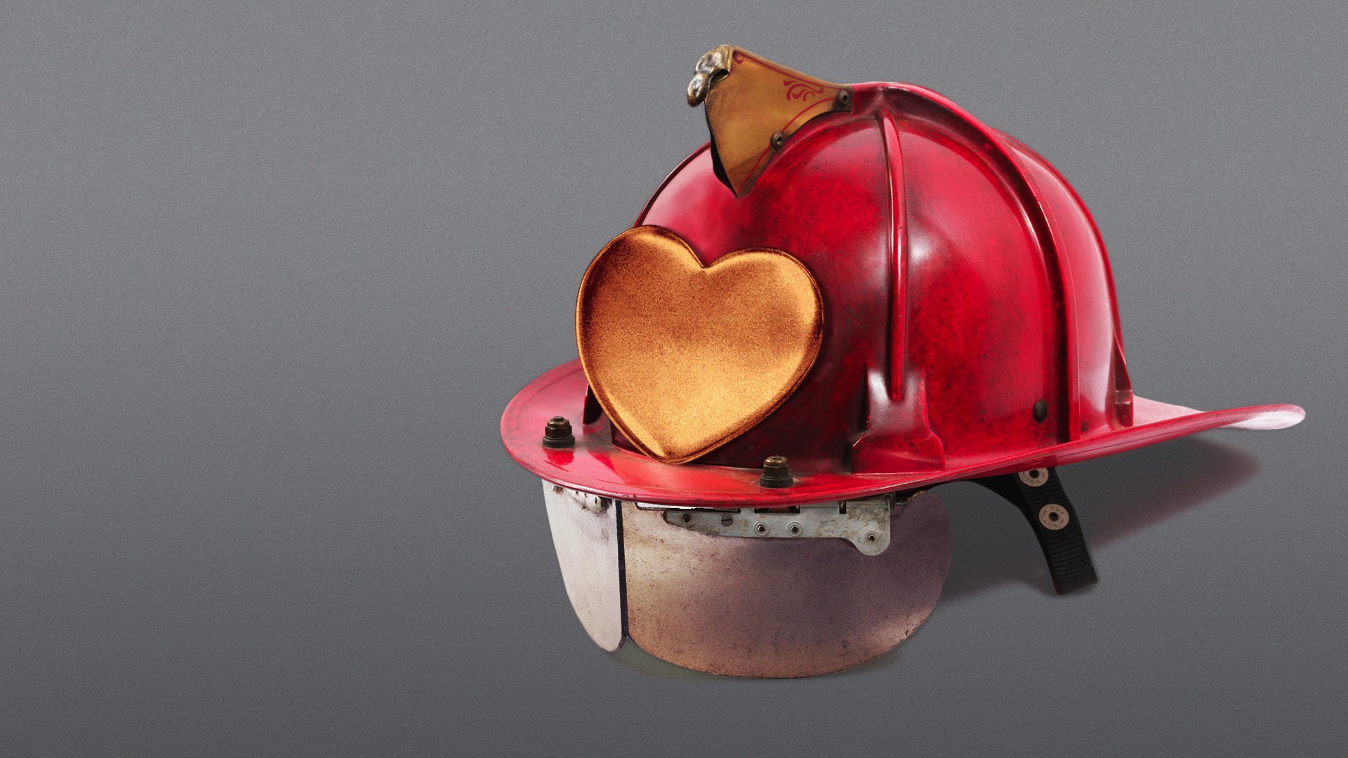 Illustration of a fire fighter's helmet with a heart emblem. 