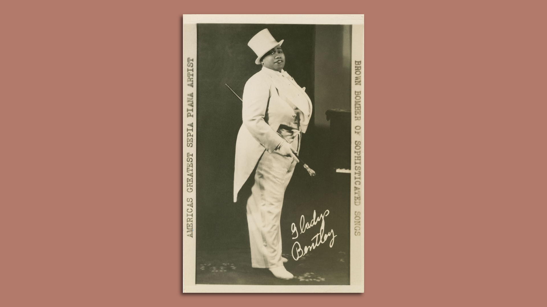 Photo of a signed photo of Gladys Bentley posing in a tuxedo and top hat
