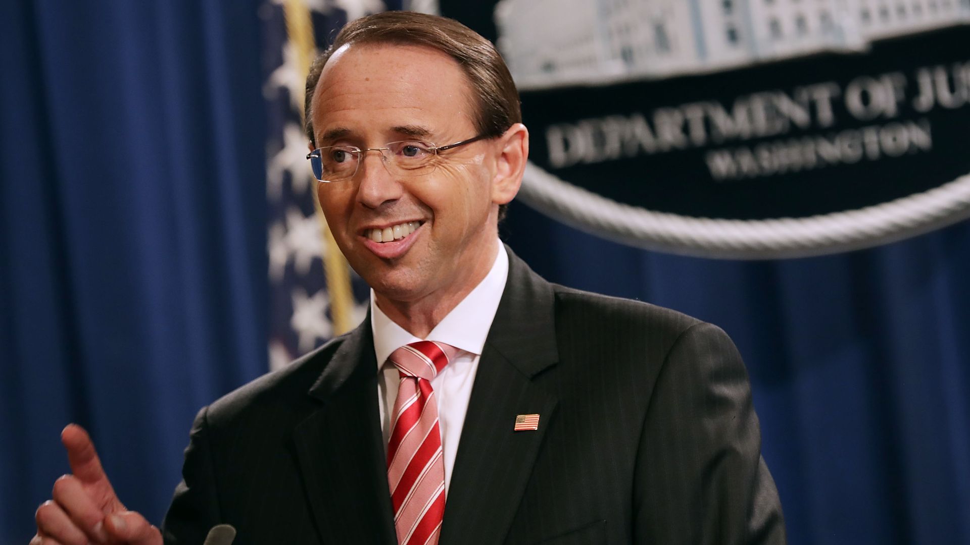 Deputy Attorney General Rod Rosenstein in front of Justice Department seal