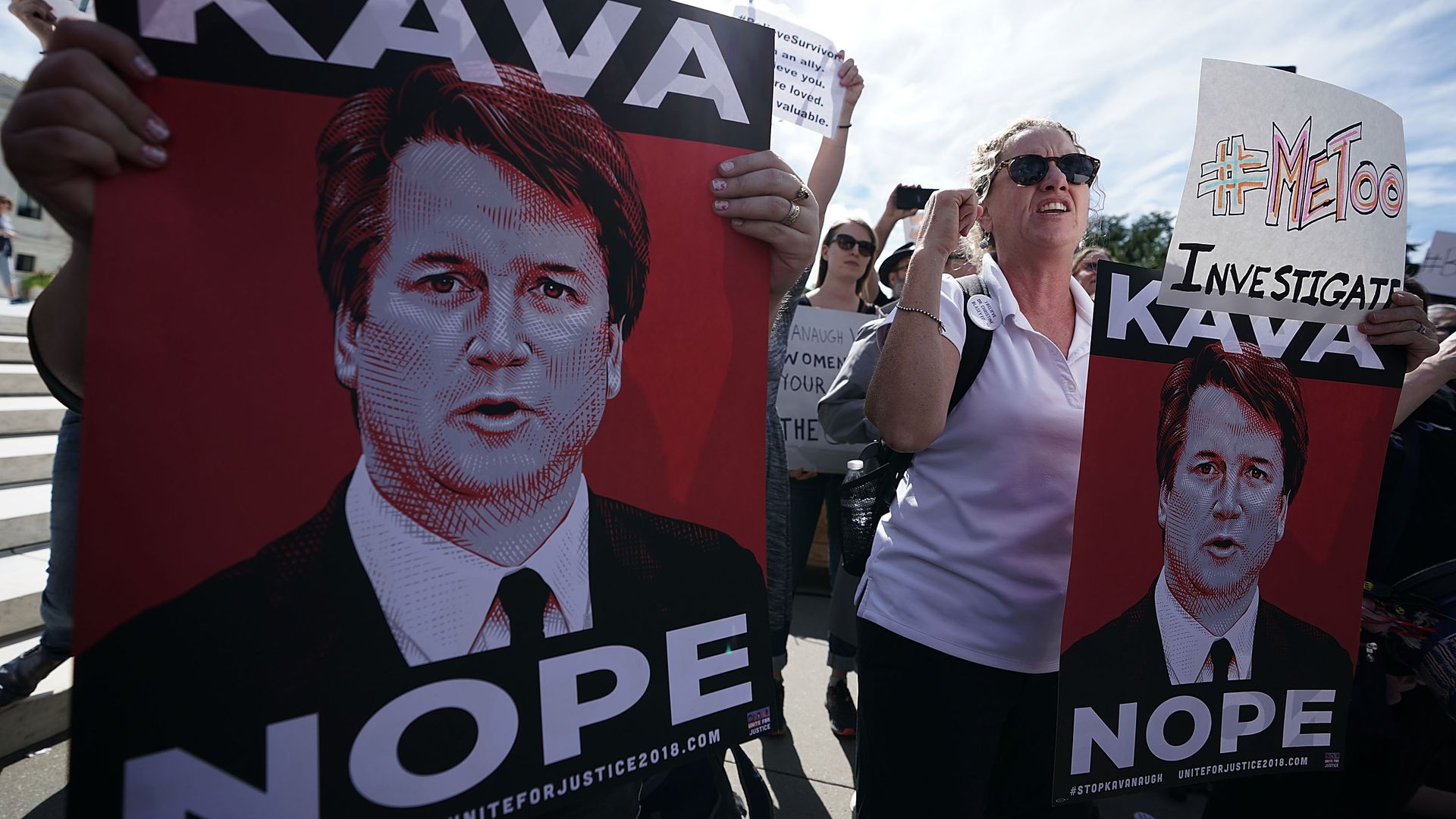Protestors holding Kava-Nope signs