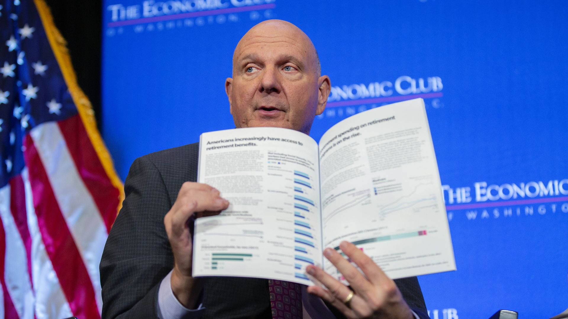 Steve Ballmer holding a brochure of facts