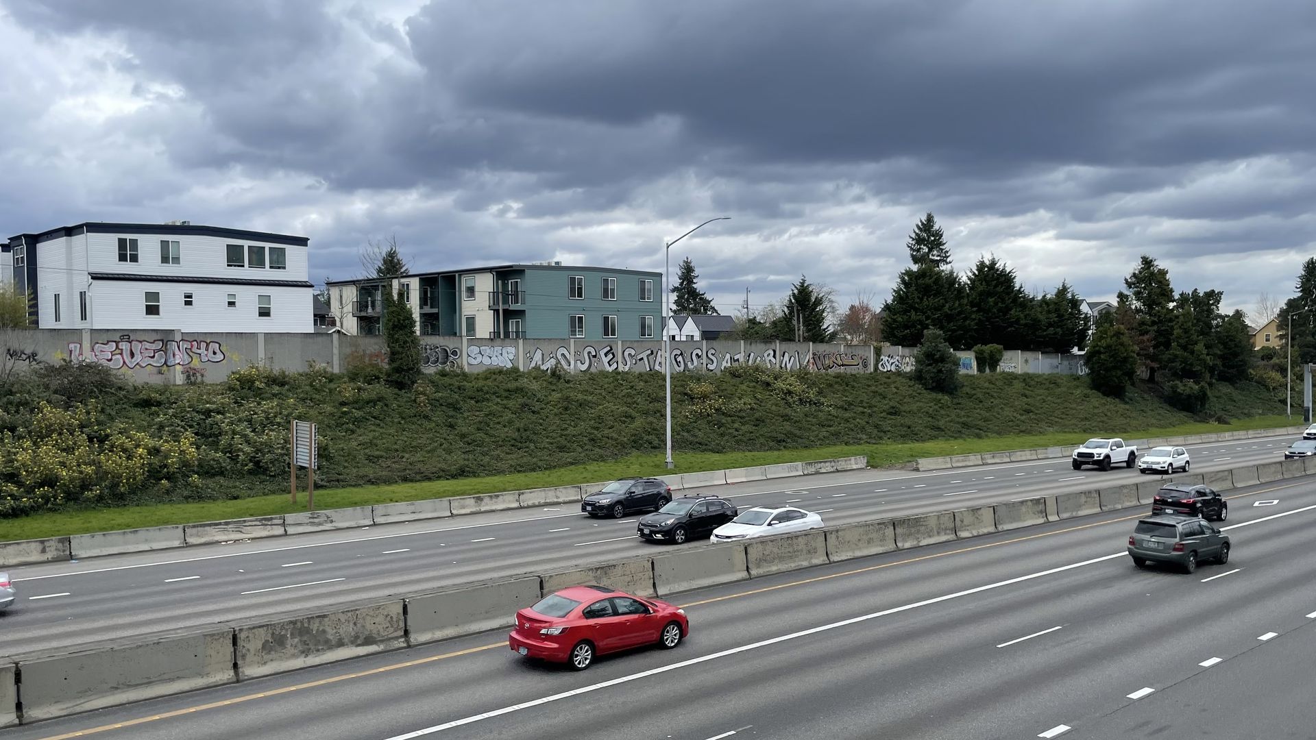 Graffiti is seen along a highway.