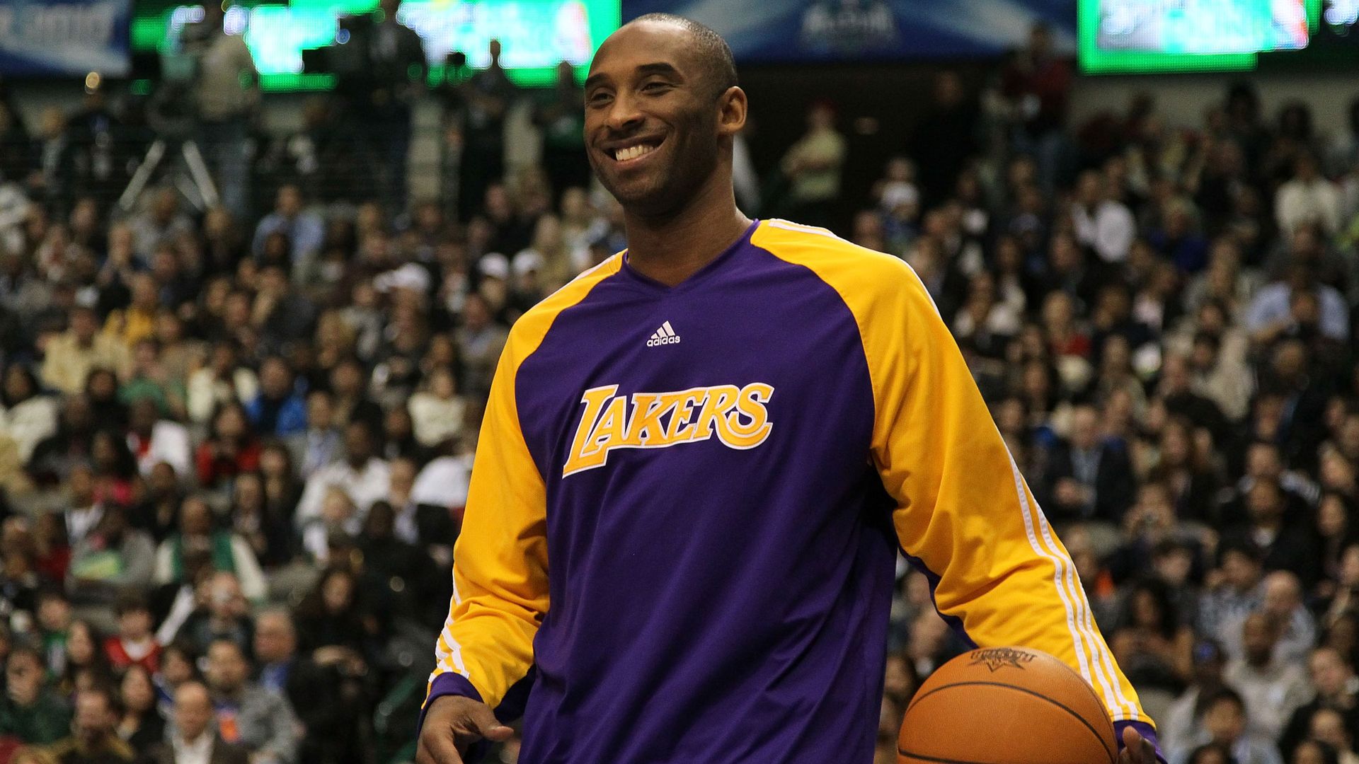 Kobe Bryant of the Los Angeles Lakers smiles while on court 