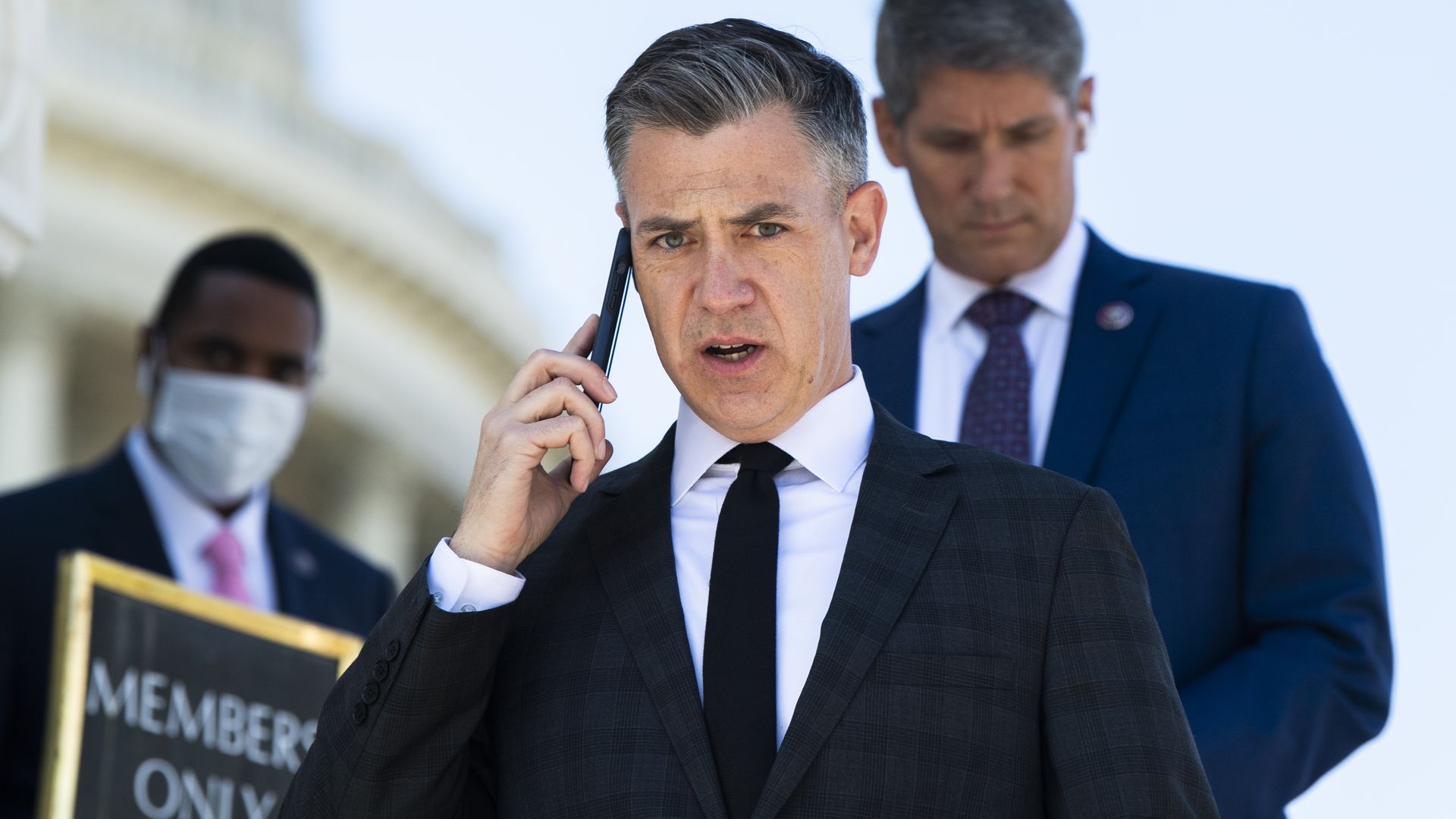 Rep. Jim Banks is seen speaking on a cellphone.