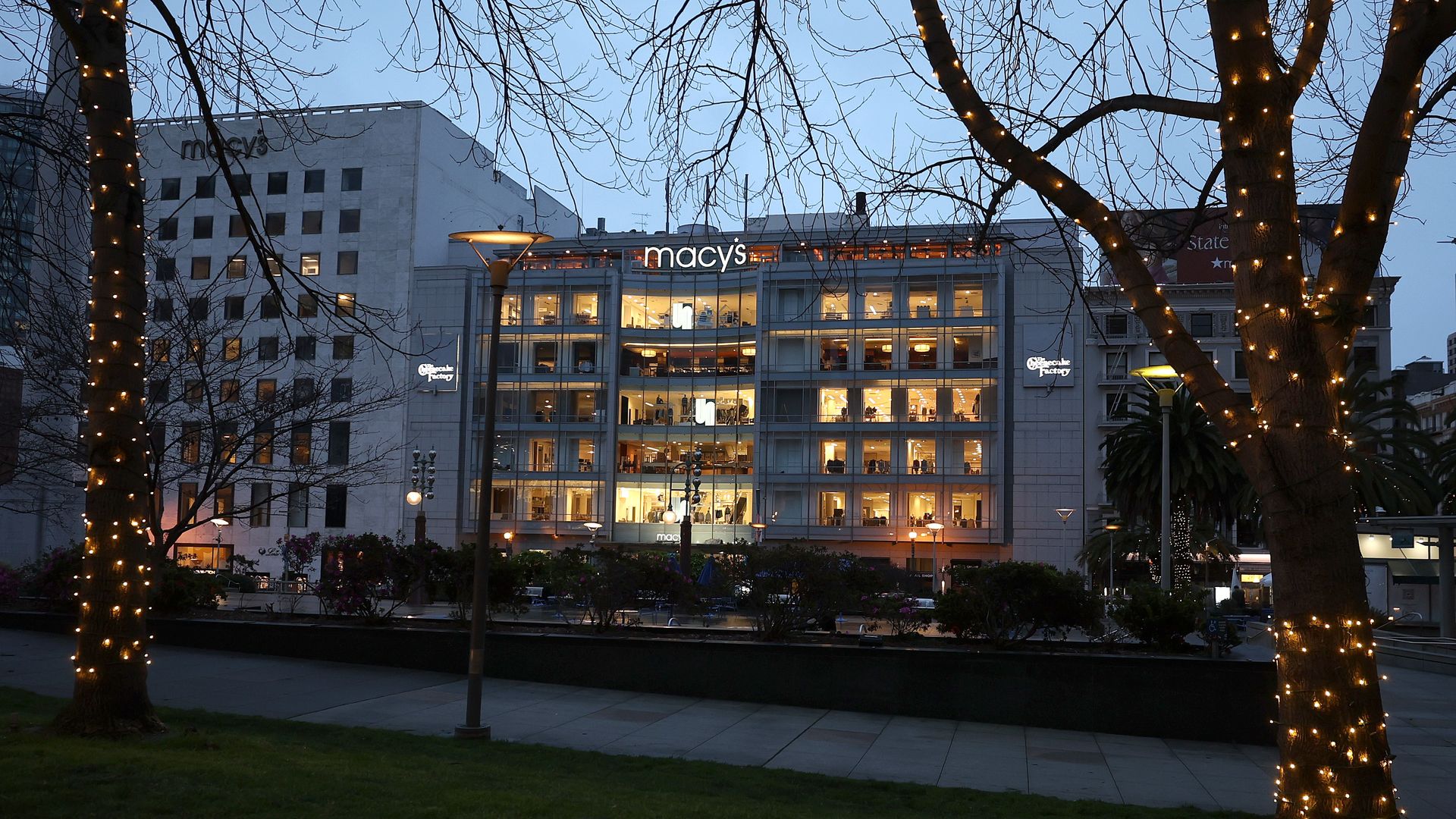 The outside of a Macy's Department store decorated for holidays