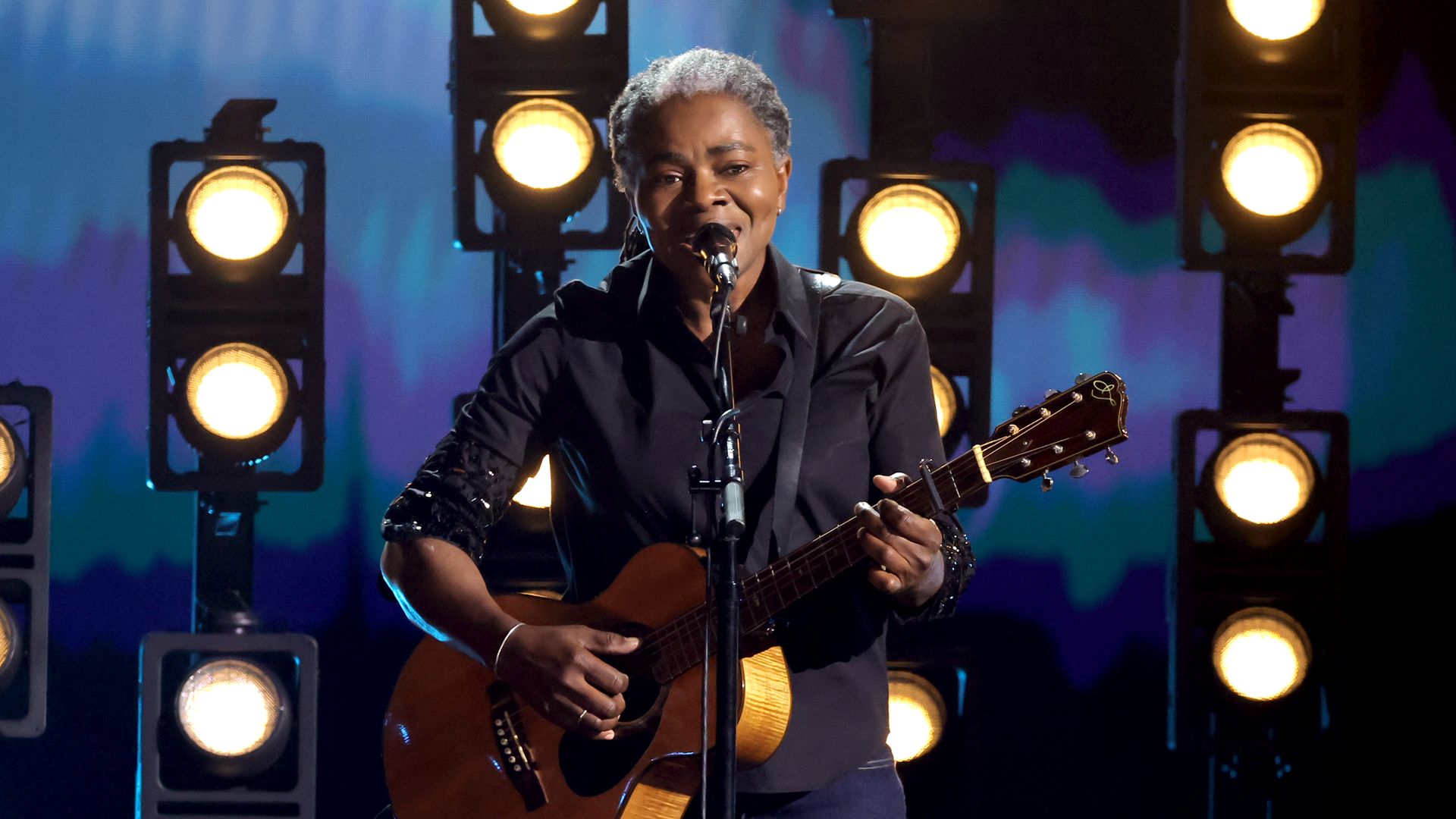 Tracy Chapman performs on acoustic guitar at the 2024 Grammy Awards. 