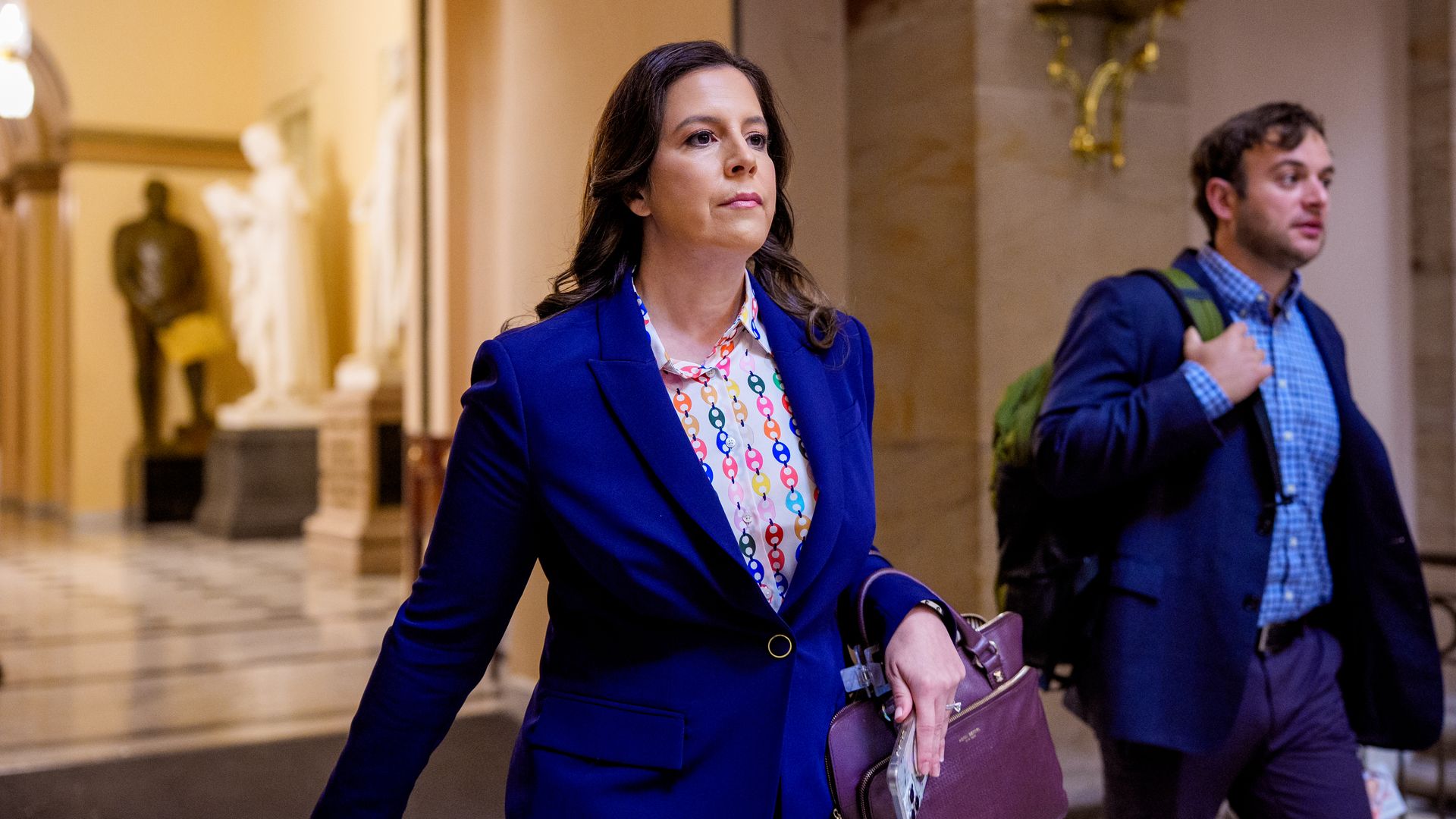Rep. Stefanik walks through the Capitol with a staffer behind her