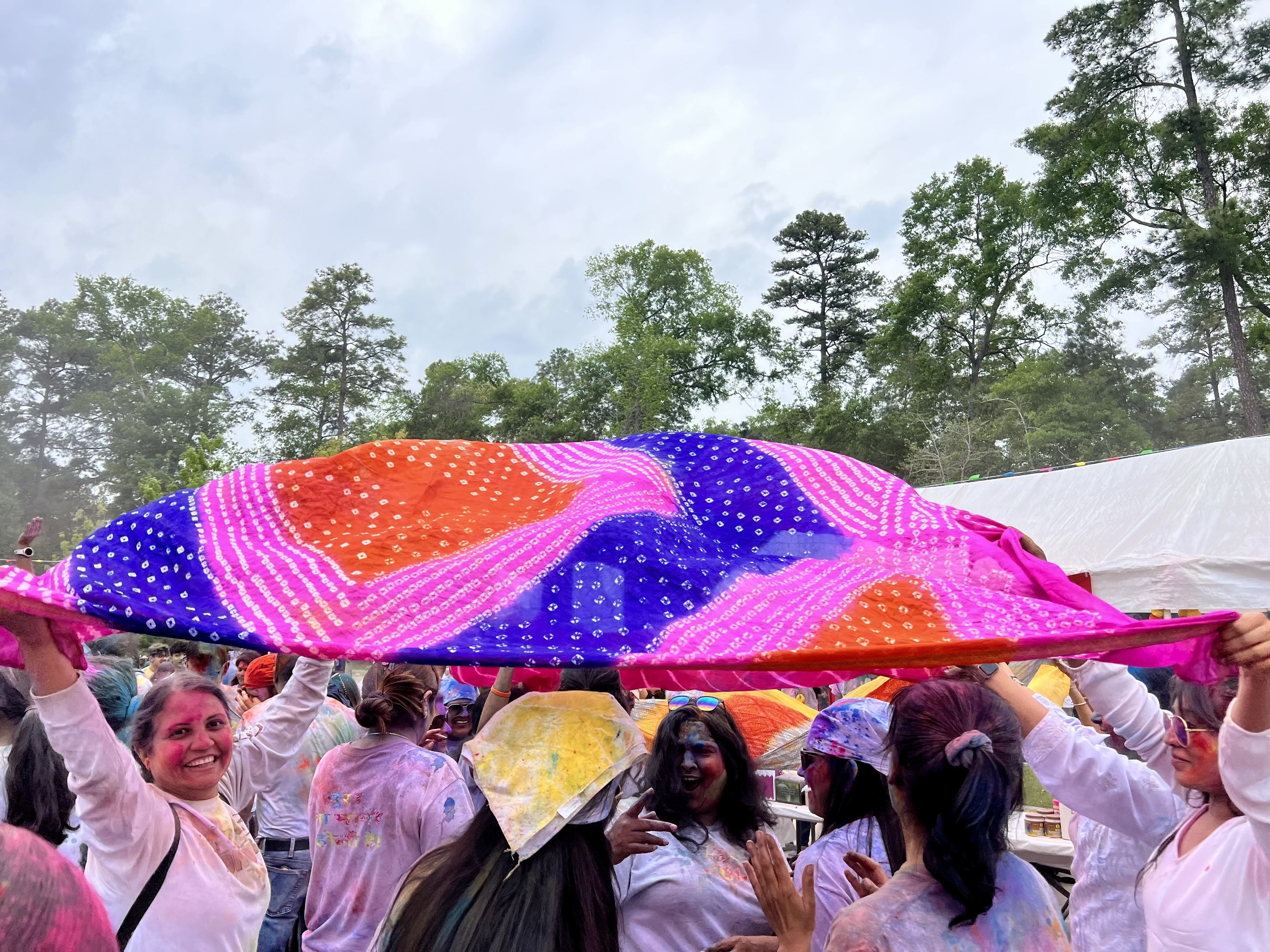 Women dancing under their scarfs