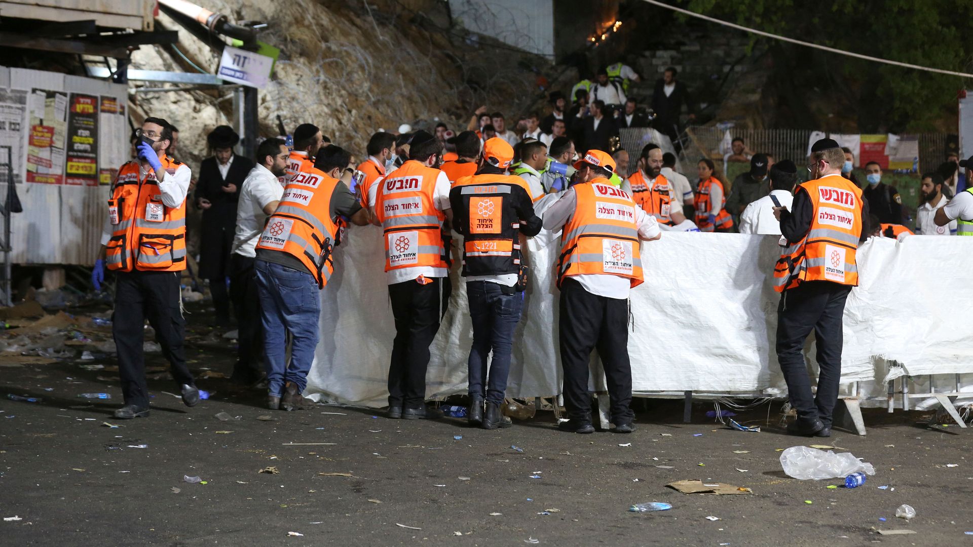 Emergency workers gather at the scene after dozens of people were killed and others injured in a stampede in Meron, Israel. 