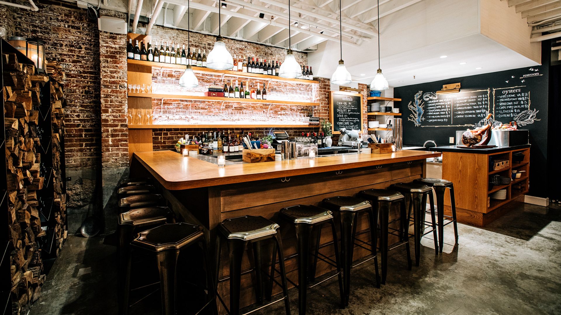 The Dabney Cellar, a wine bar with a chalkboard menu and ham slicer in the corner