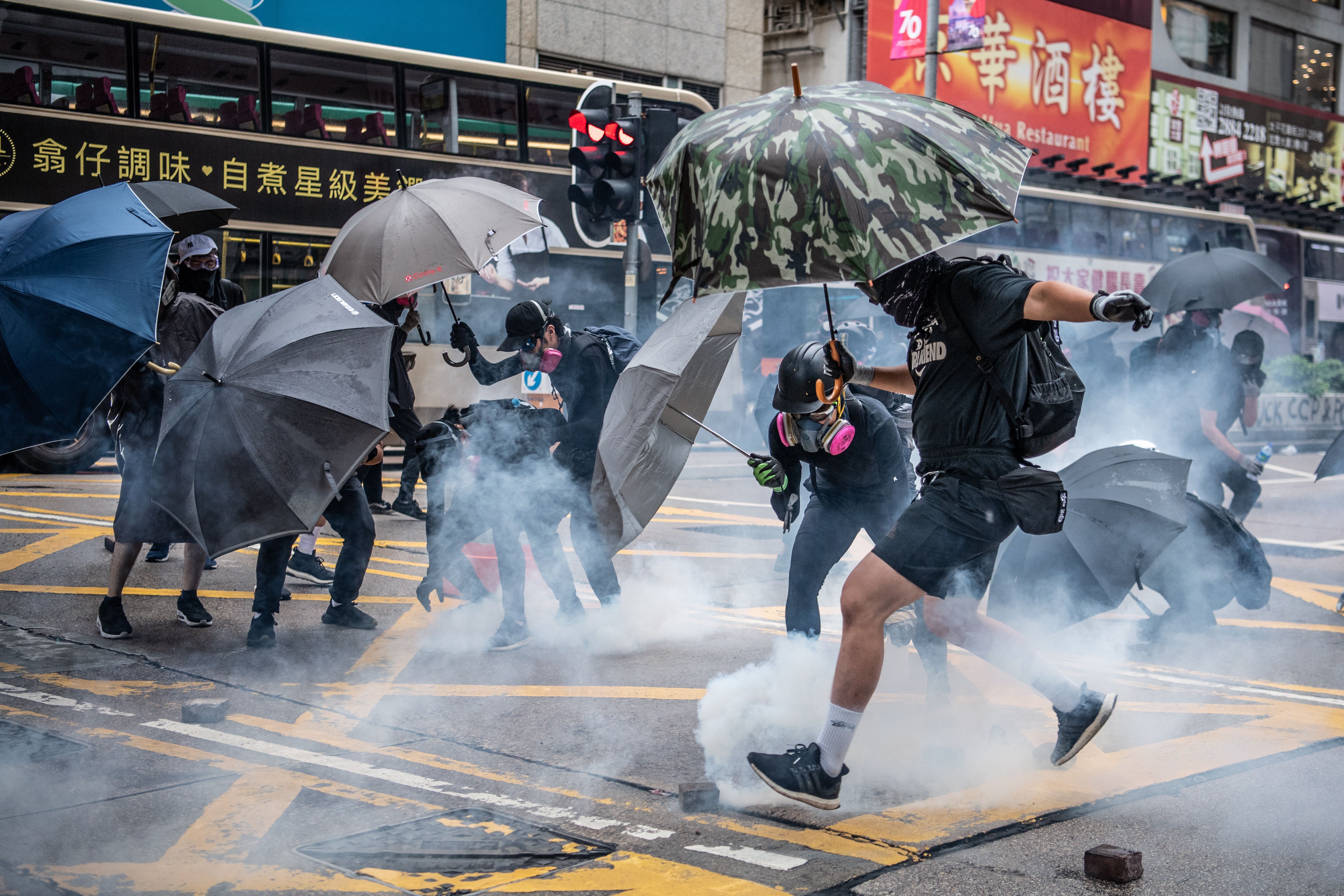 Protesters clash with police during a protest in Kowloon