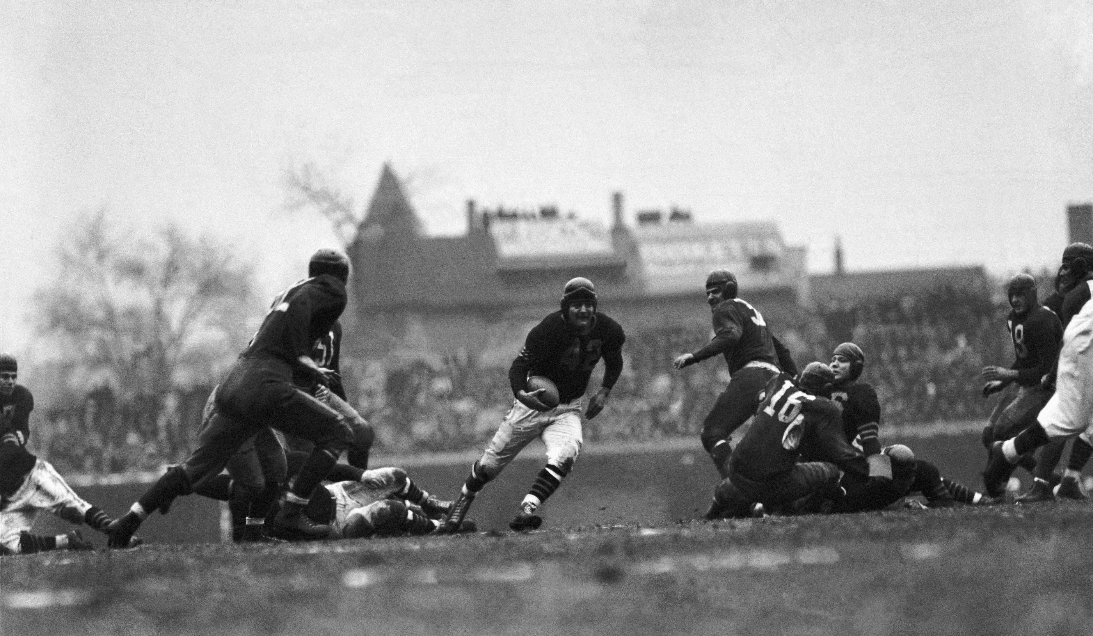 Photo of a football player running on the field 