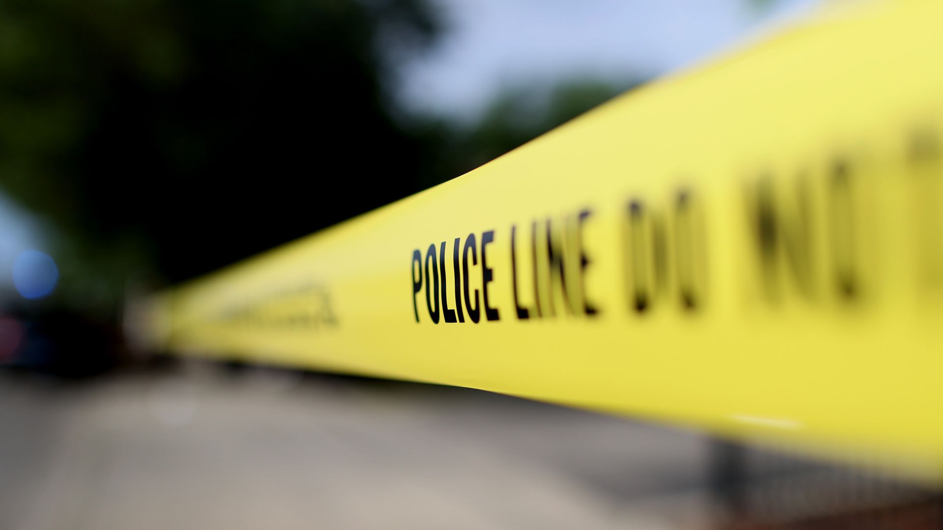 A photo of yellow police tape.