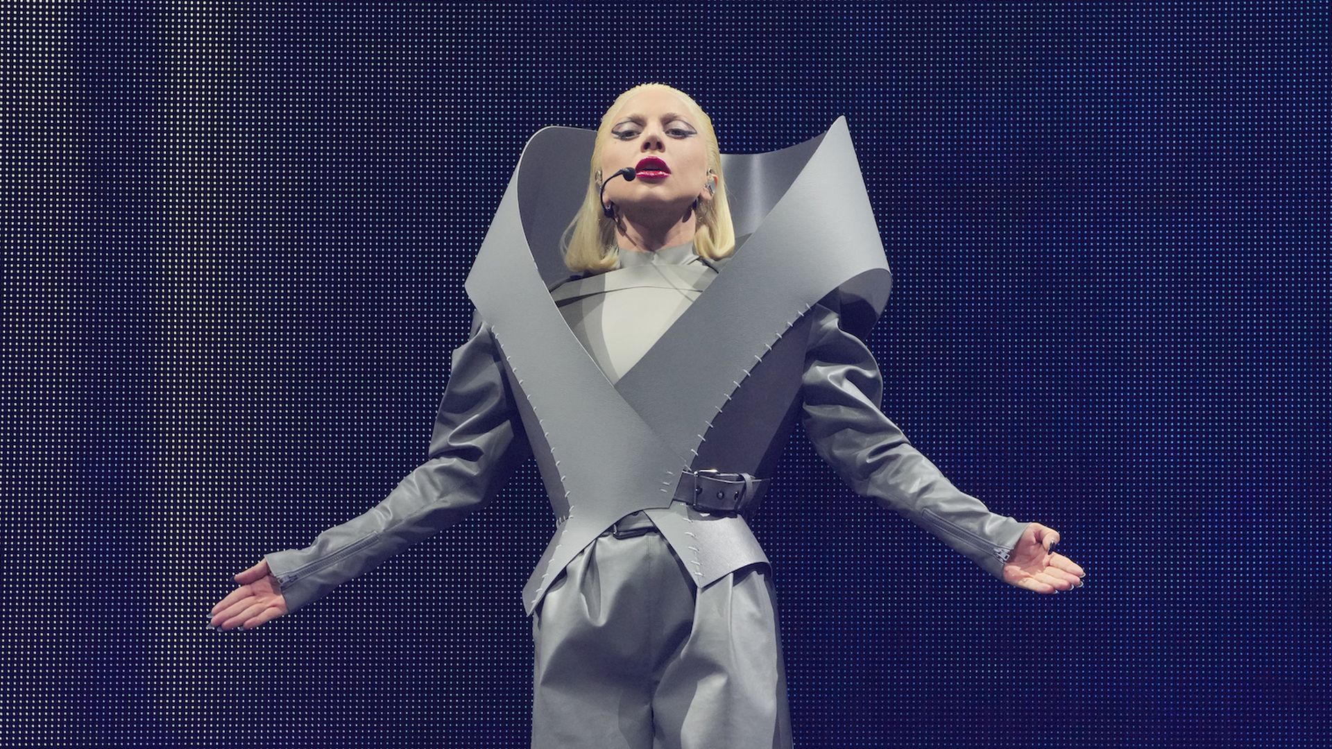 Lady Gaga poses on stage. 