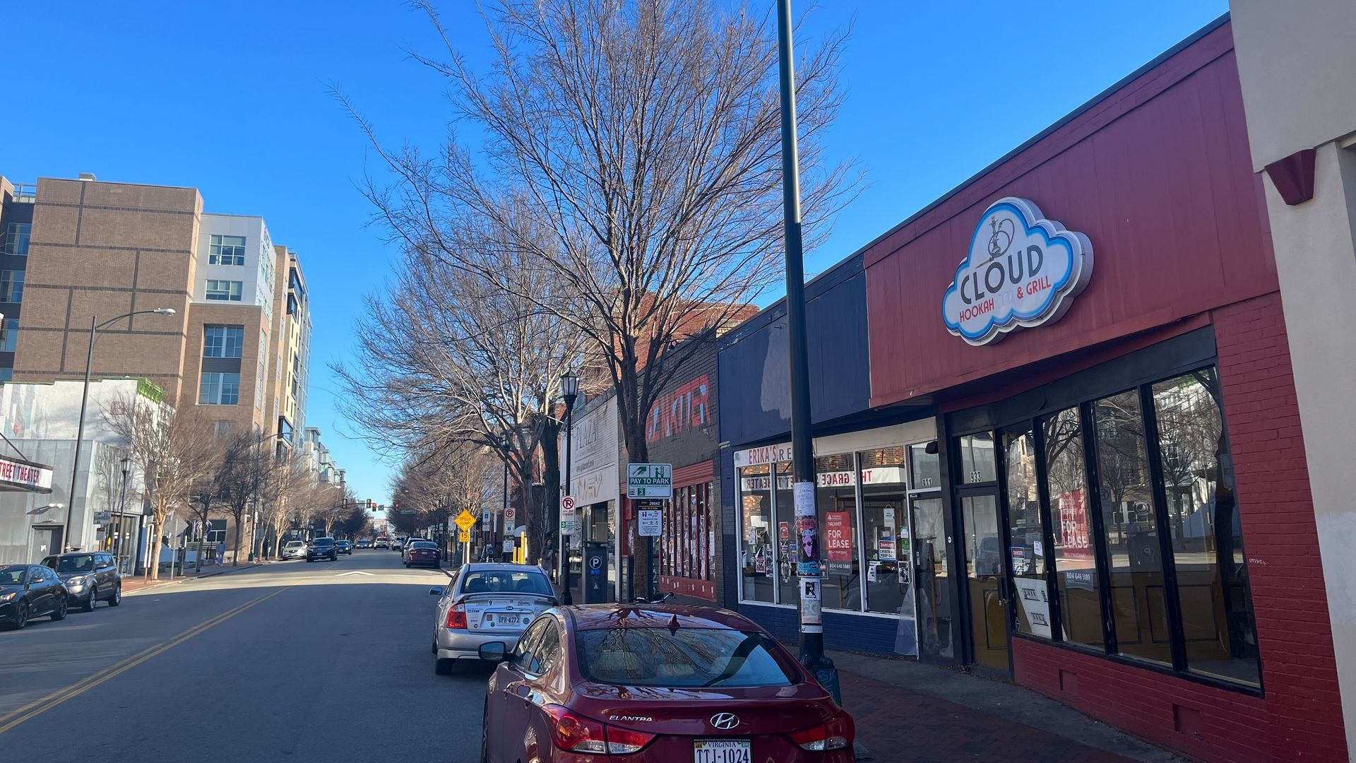 A nice, clean looking street with cars 
