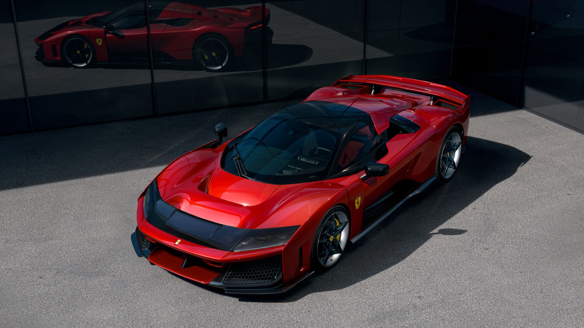 A red ultra-luxury two-seat supercar from above