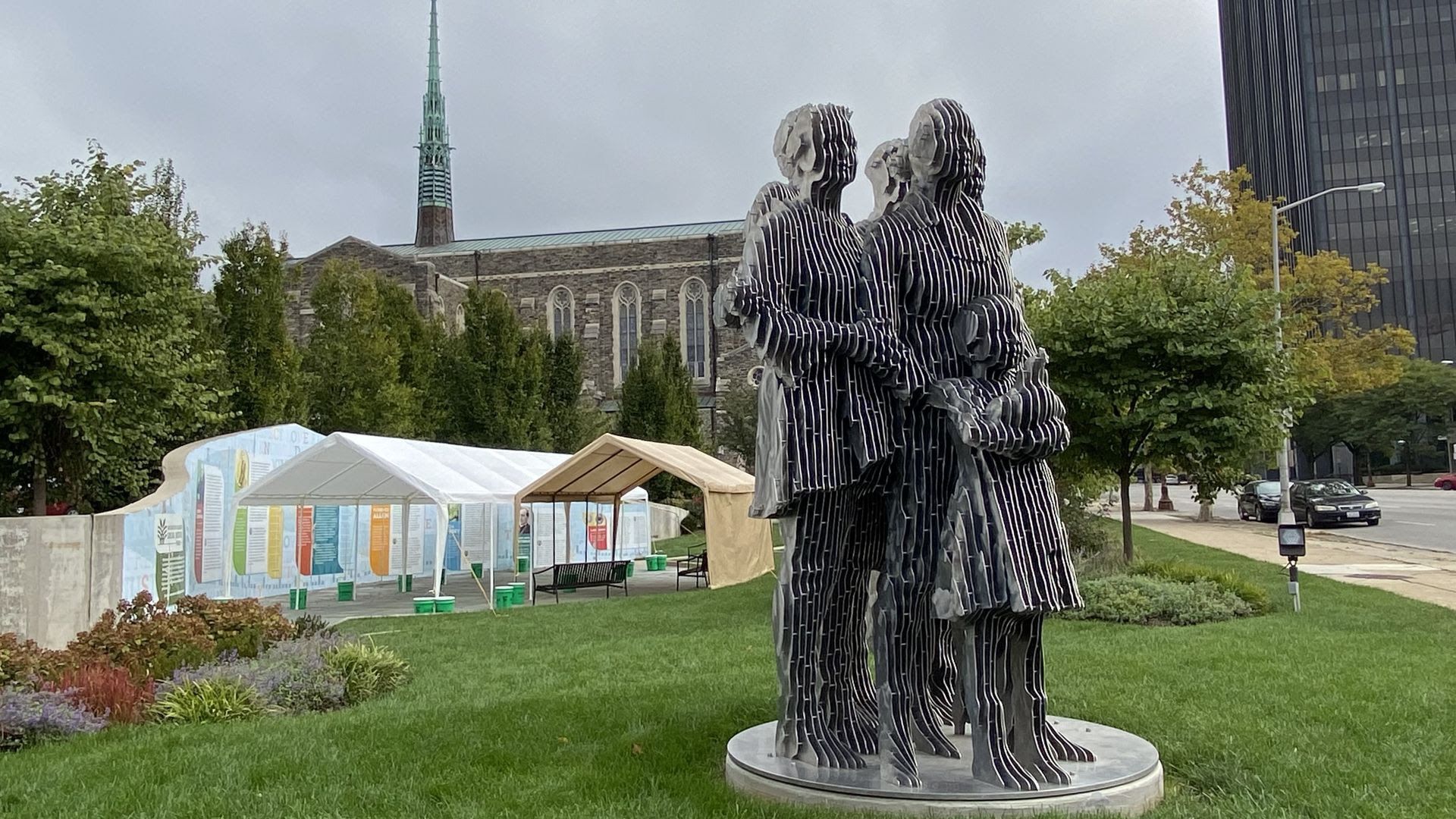 Metal statues of people stand at the center of Washington Gladden Social Justice Park 