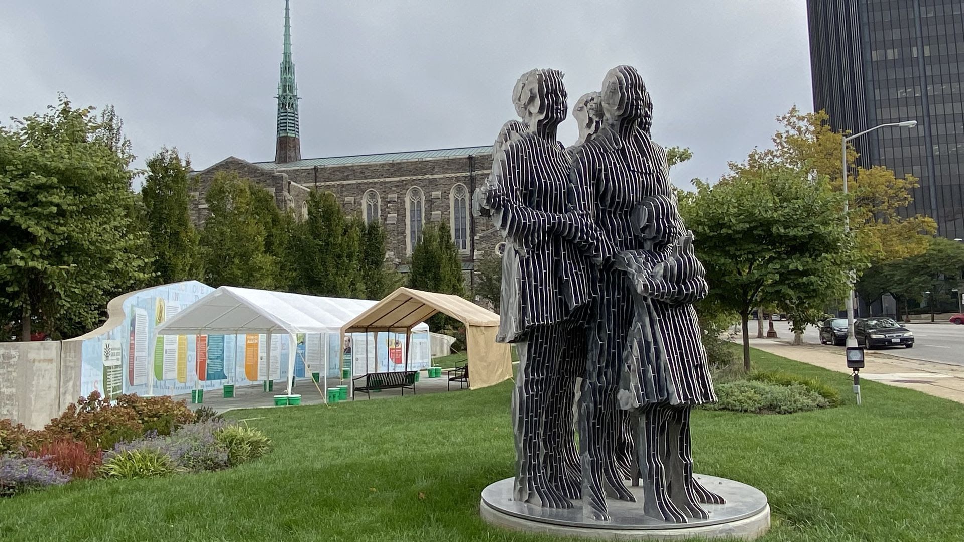 Metal statues of people stand at the center of Washington Gladden Social Justice Park