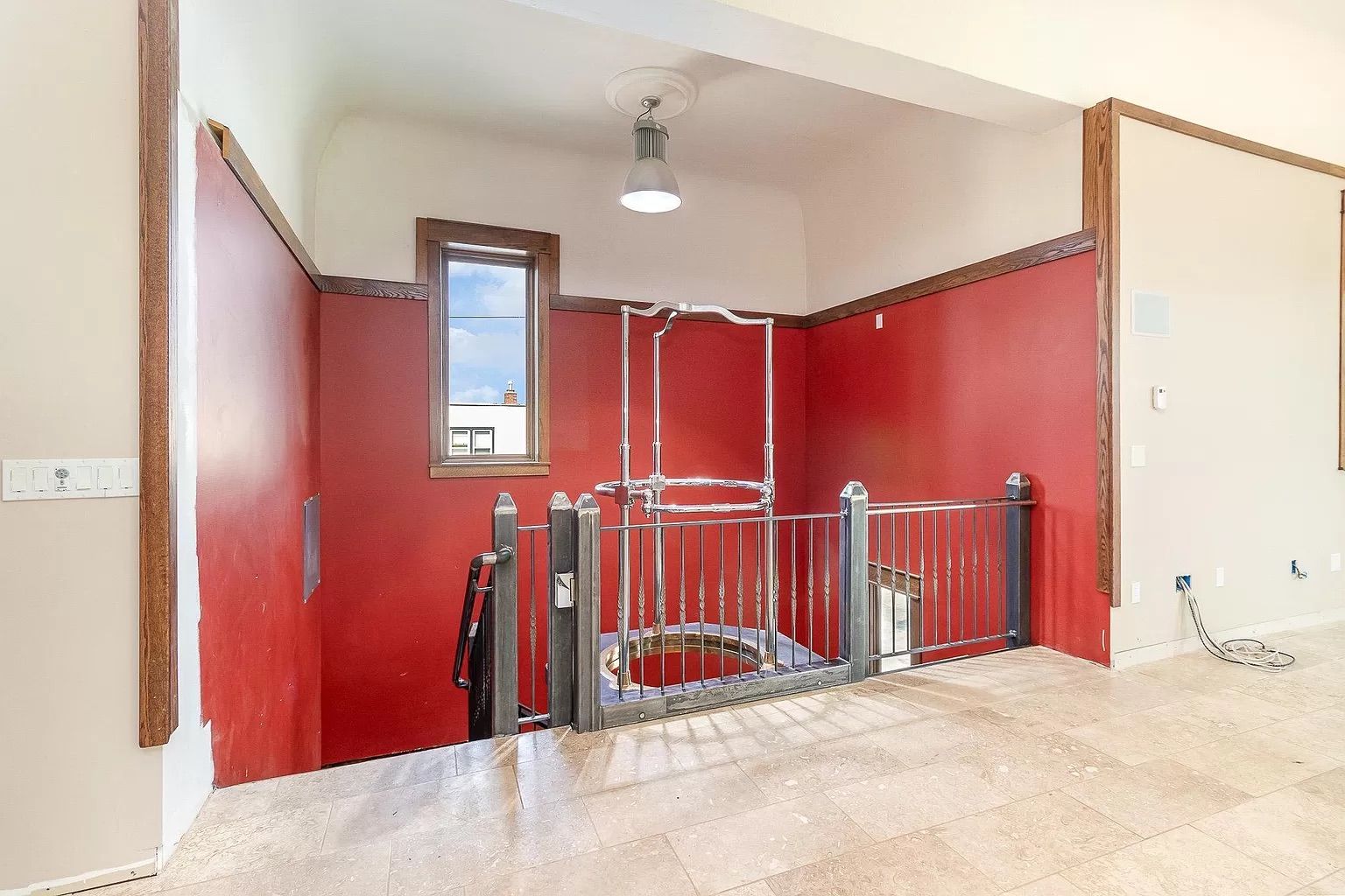 A staircase and space where a firepole used to be.