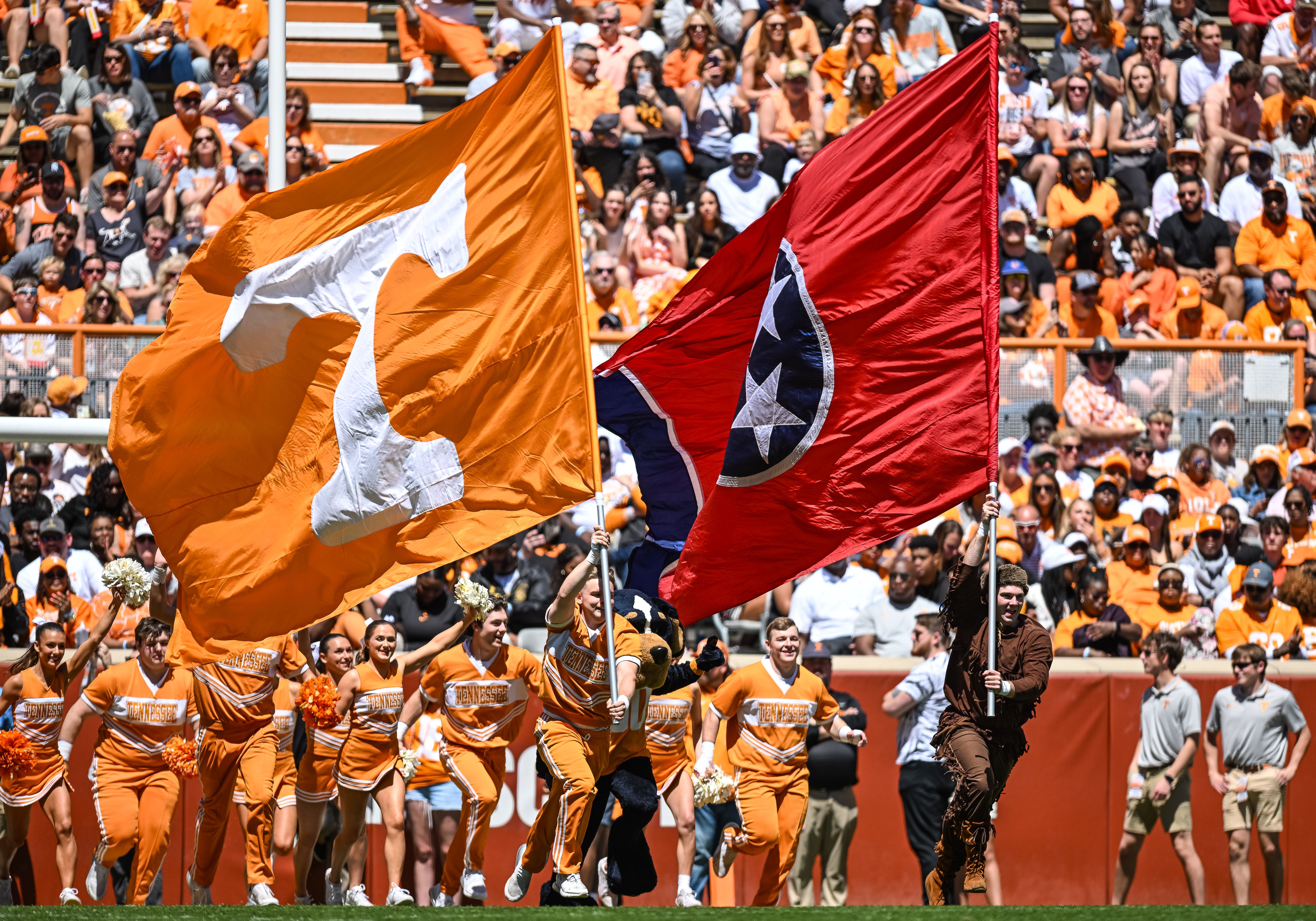 Tennessee flags fly on the football field.