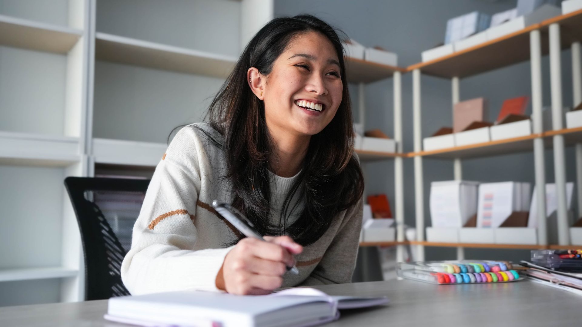 Linda Tong writing in a planner