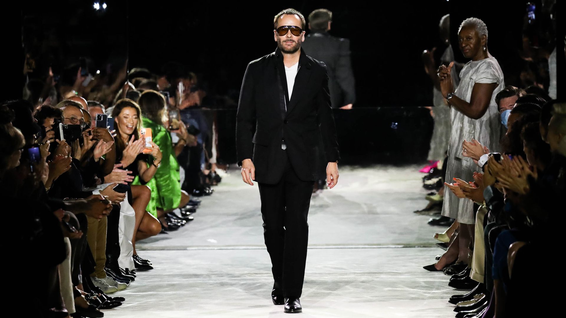 Tom Ford walks the runway at the conclusion of his Tom Ford SS22  