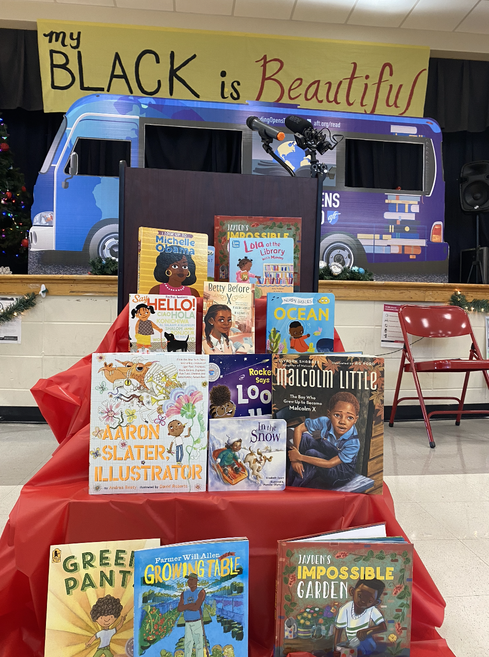 A children's book display in a school auditorium.