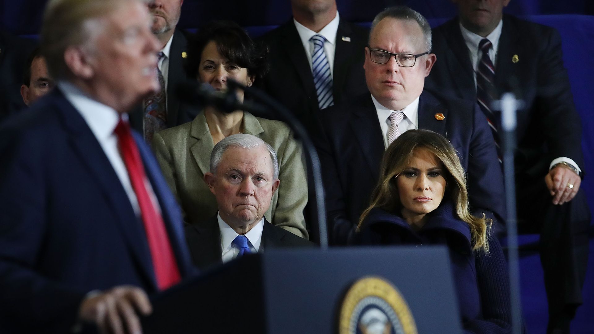 Jeff Sessions listens on to President Trump.