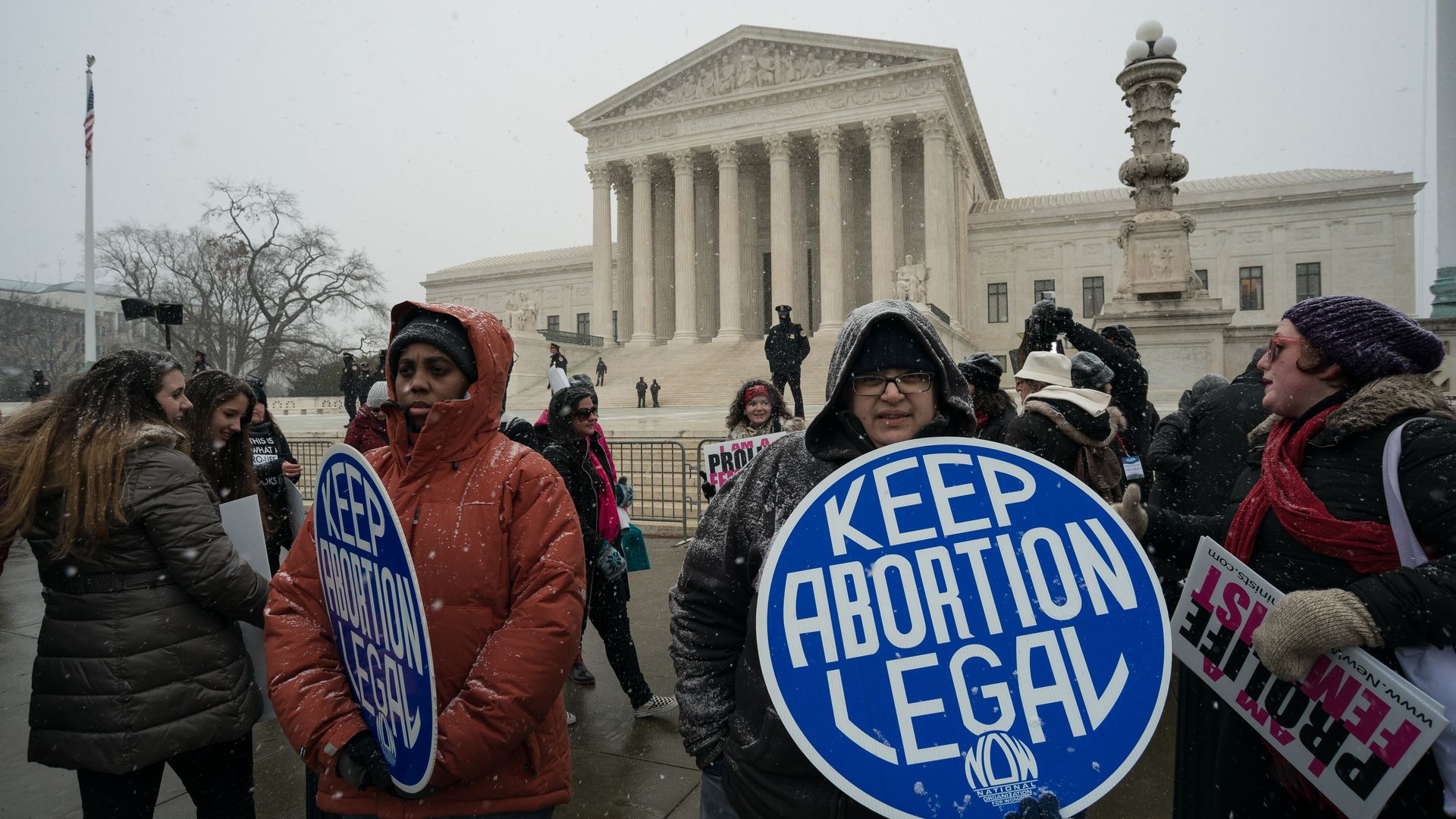 Protesters wave a "Keep Abortion Legal" sign outside the Supreme Court