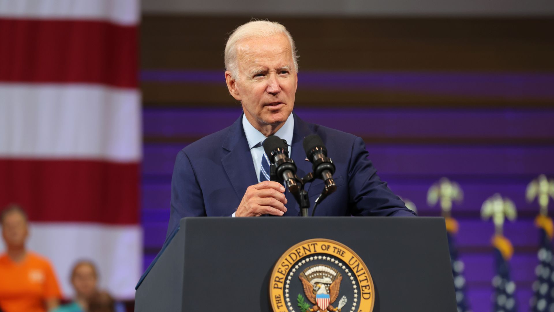Photo of Joe Biden speaking from a podium at an event