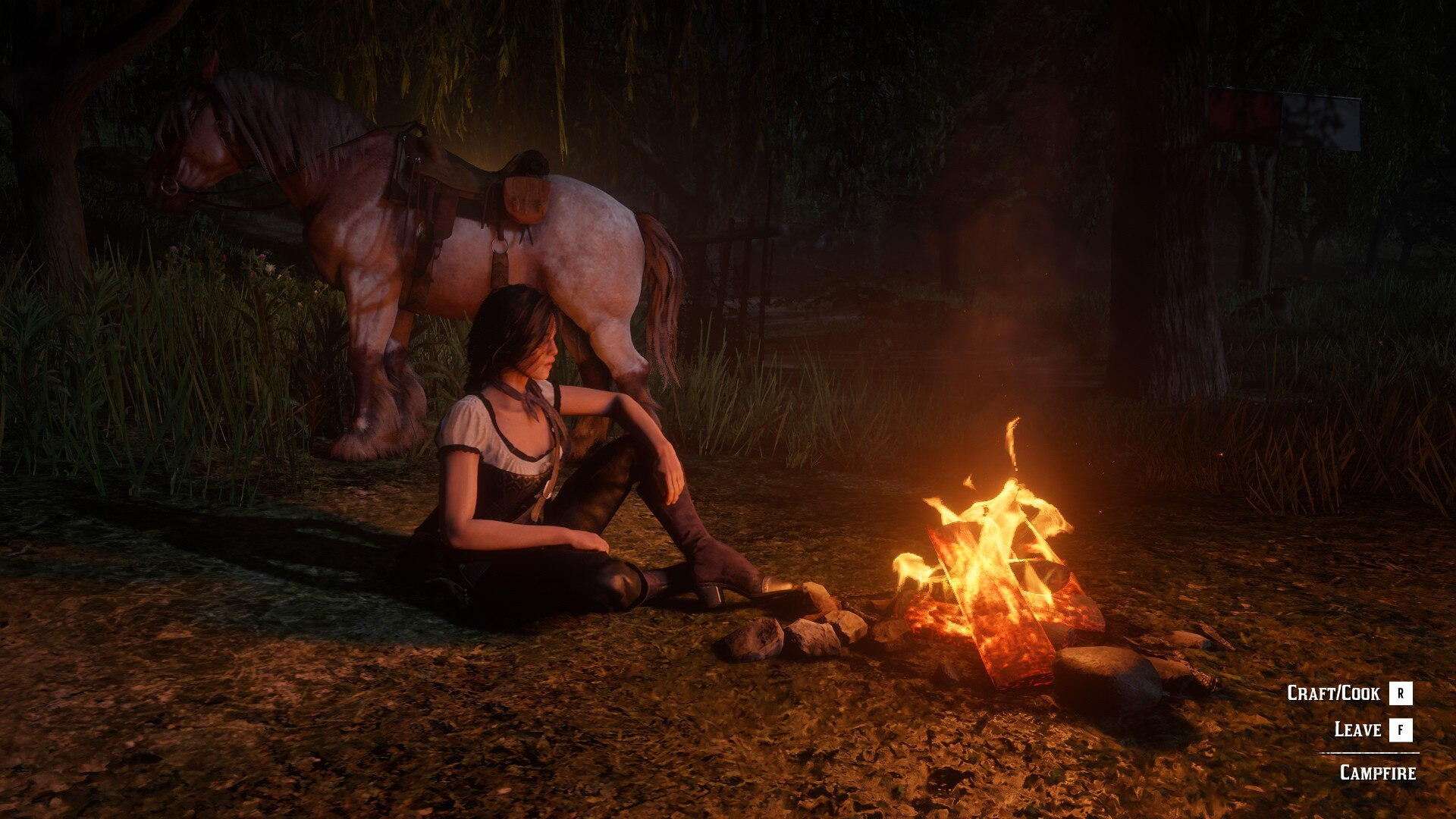 Video game screenshot of a cowgirl sitting at a campfire at night, her horse standing nearby