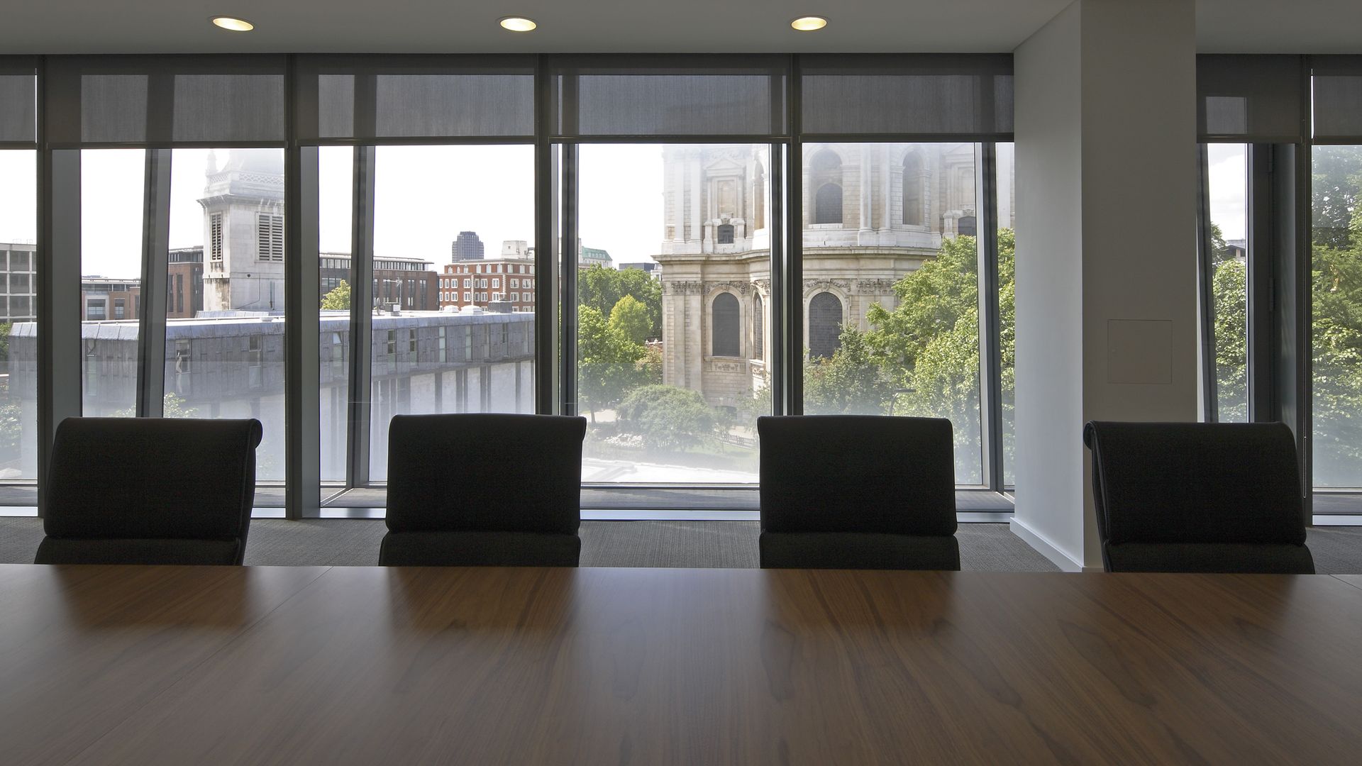 A boardroom with empty chairs.
