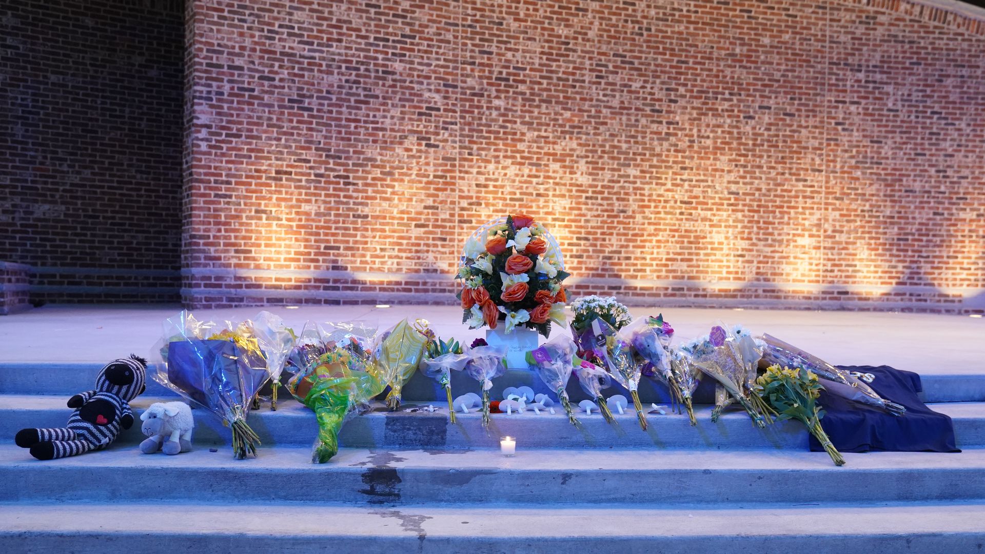  Flowers are laid out as students and faculty as well as community members gather for a vigil after a shooting at Apalachee High School on September 4.