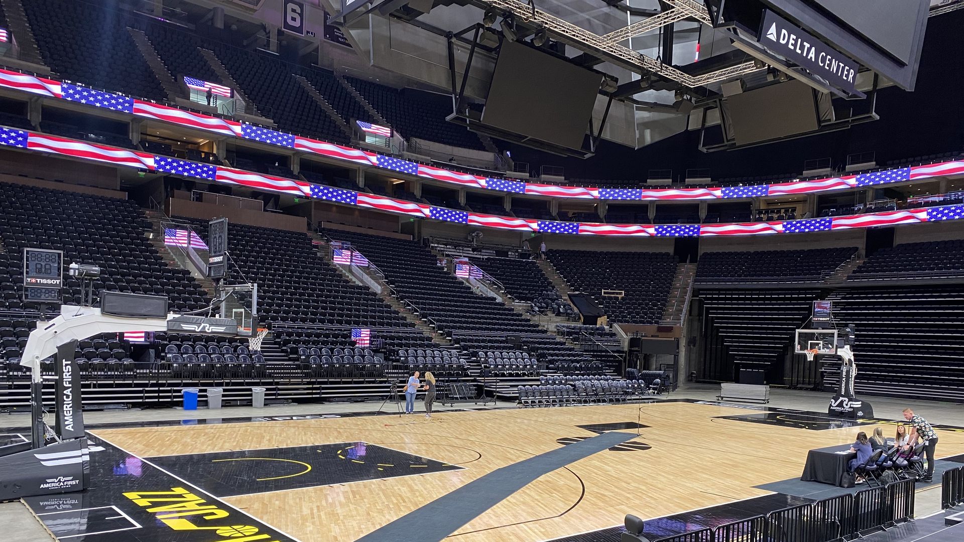 An empty basketball court with a microphone in the middle