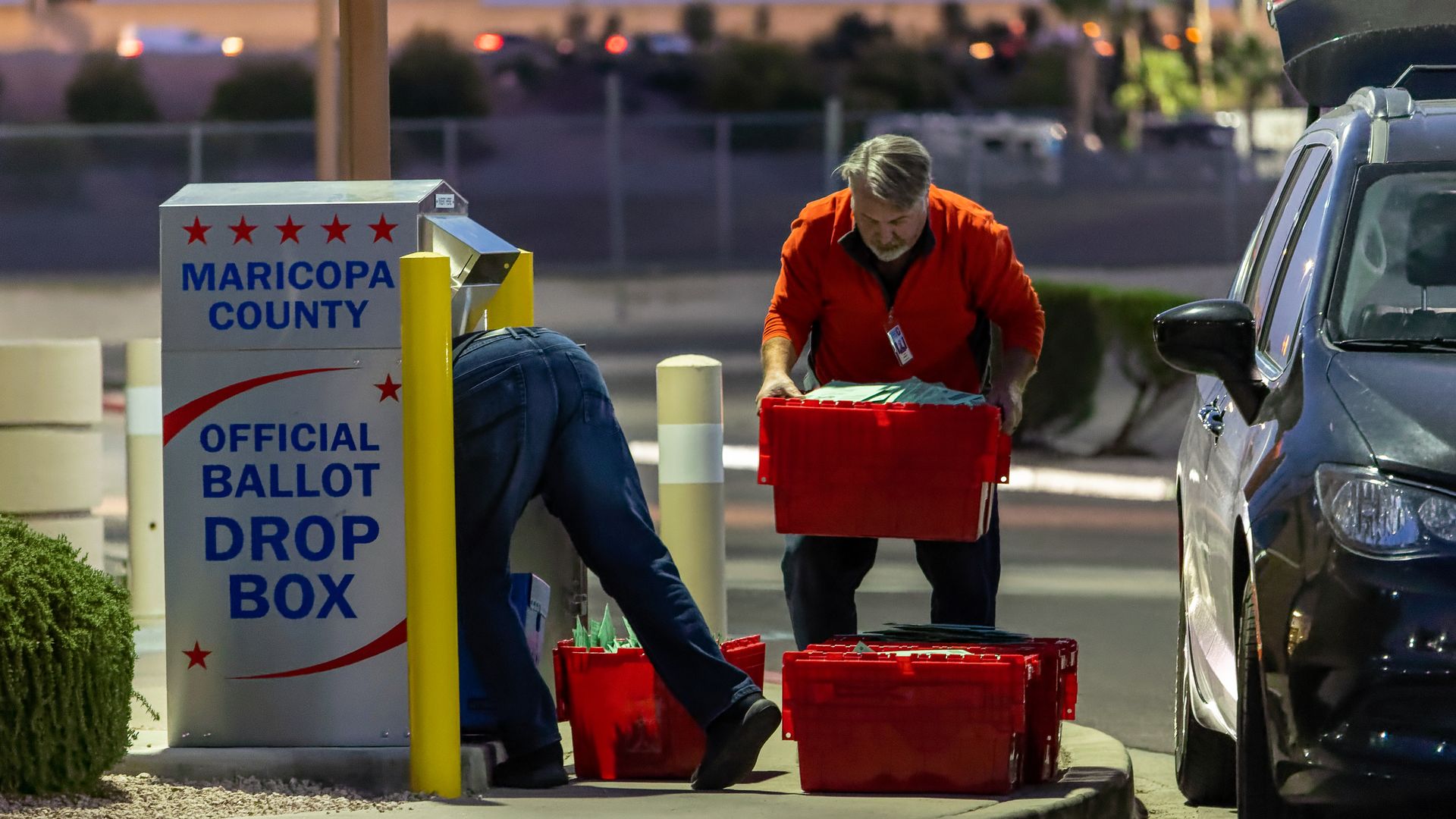 Maricopa County election workers remove ballots from a drop box on November 08, 2022 in Mesa, Arizona.