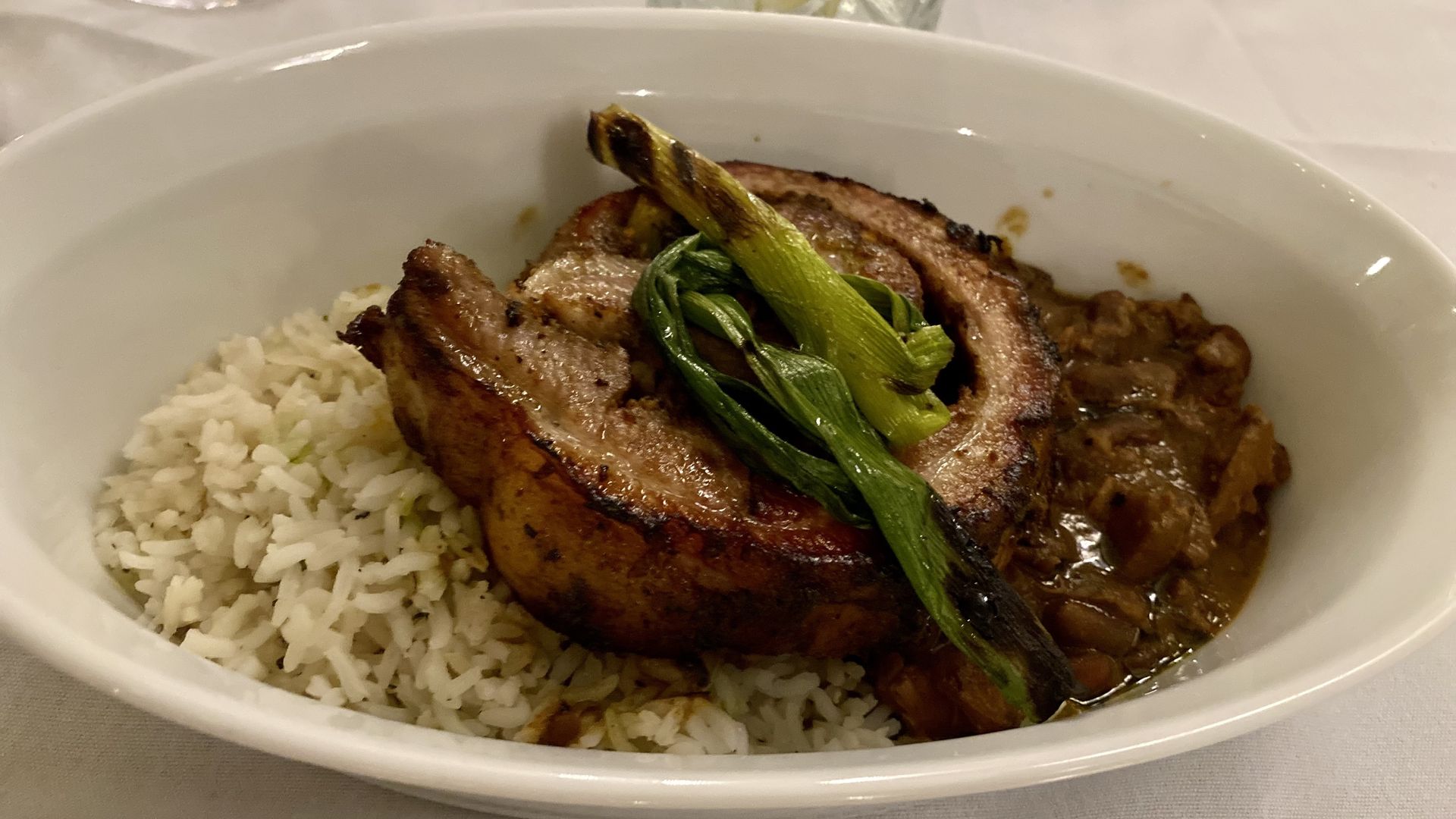 A delicate piece of meat served over rice