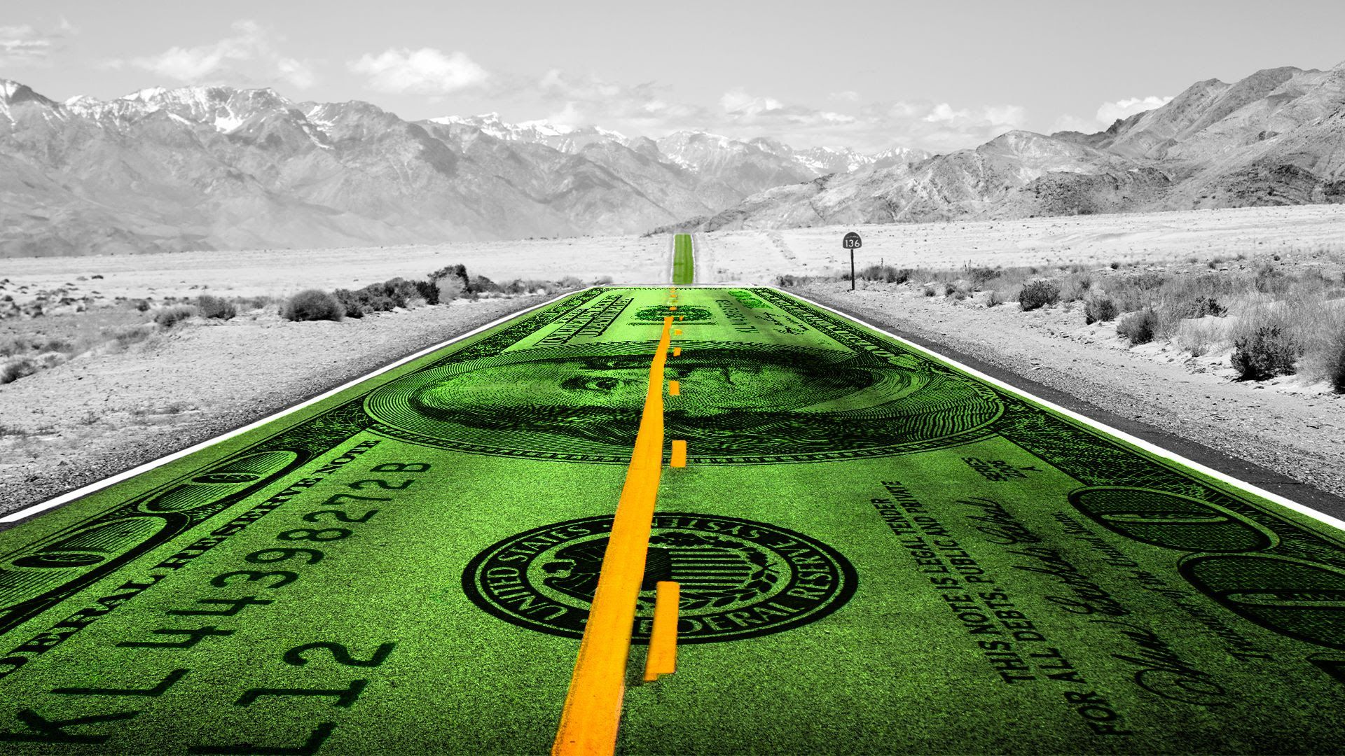 A green dollar bill formed into a road, leading through a mountain pass
