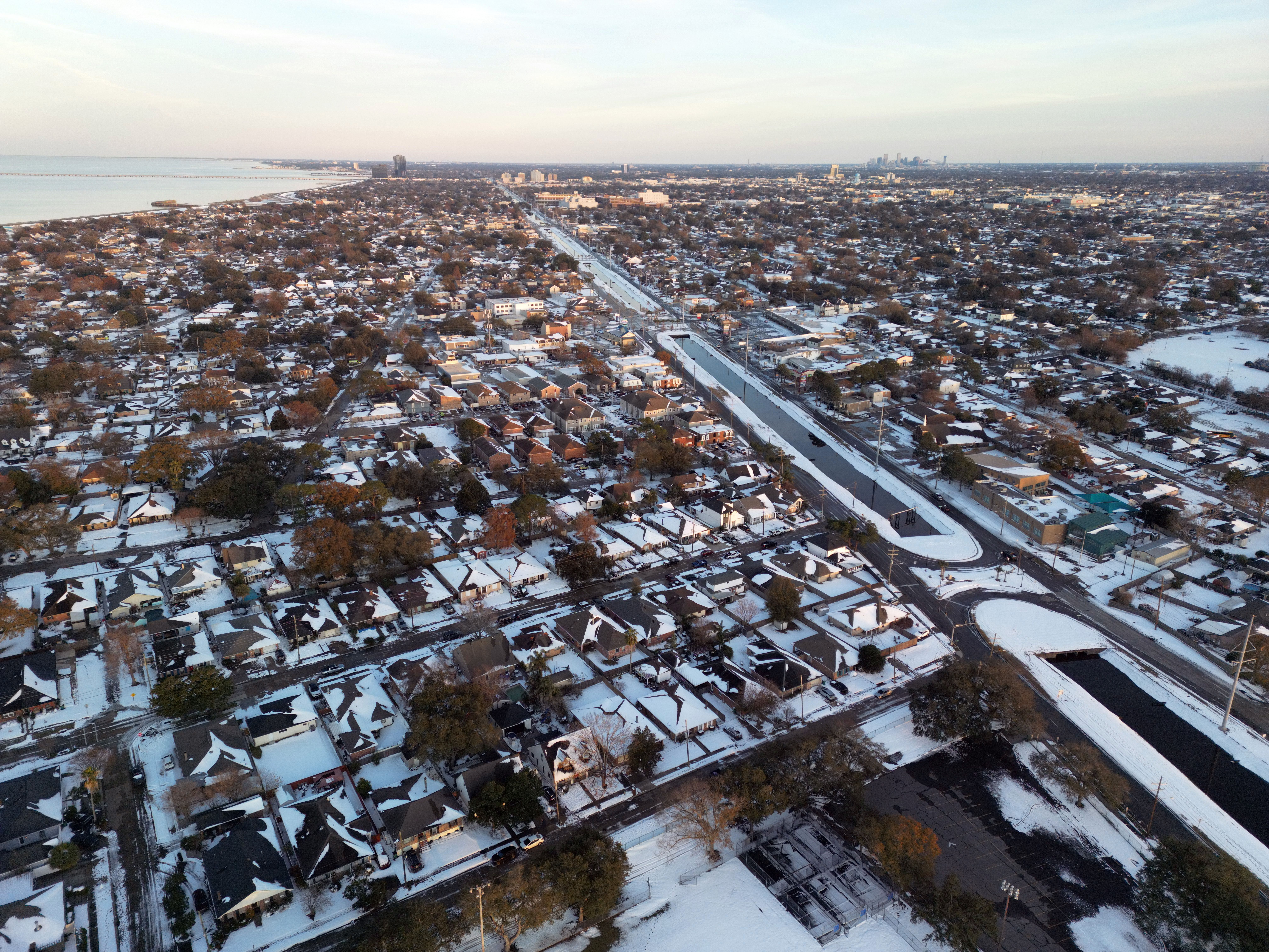 Image show an aerial shot of the snow over Metairie.