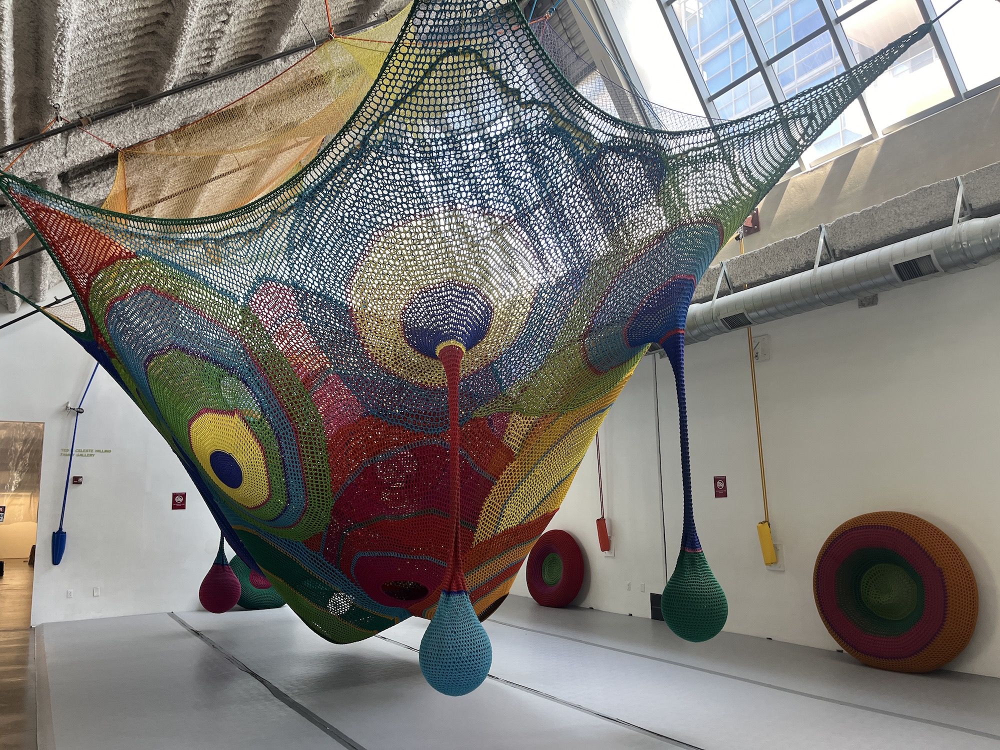 A giant multi-colored crochet sculpture.