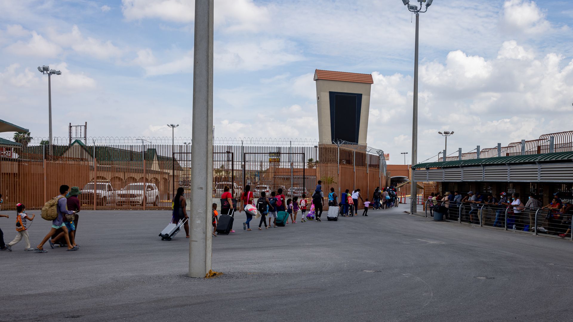 Asylum seekers are escorted into the U.S. from Mexico.