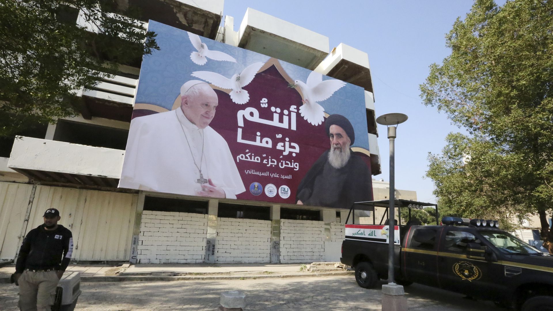 A giant billboard bears portraits of Pope Francis and Grand Ayatollah Ali Sistani in Baghdad. 