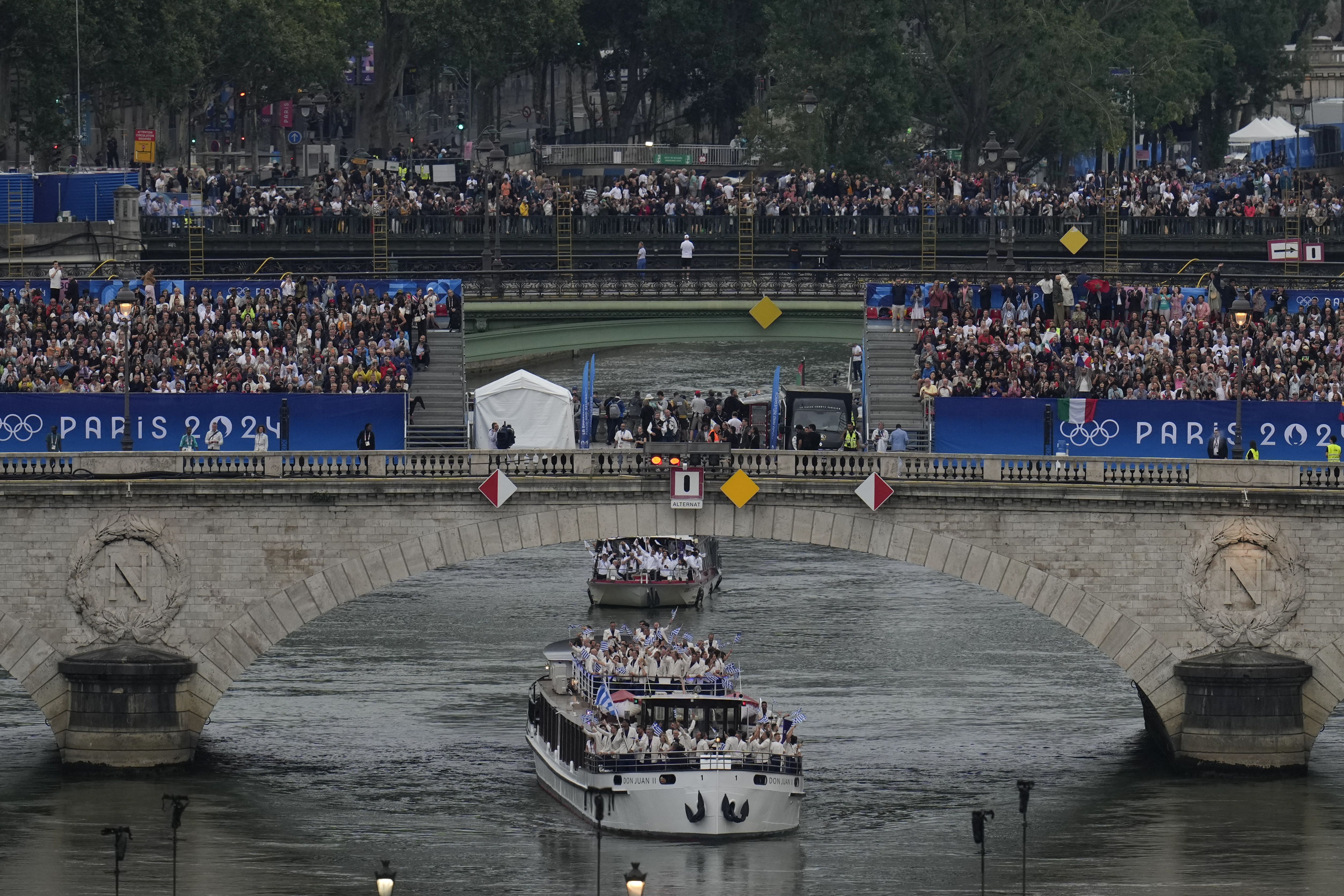Team Greece travel by boat along the Seine river in Paris, France, during the opening ceremony of the 2024 Summer Olympics, Friday, July 26, 2024. (Photo by Ricardo Mazalan / POOL / AFP) (Photo by RICARDO MAZALAN/POOL/AFP via Getty Images)