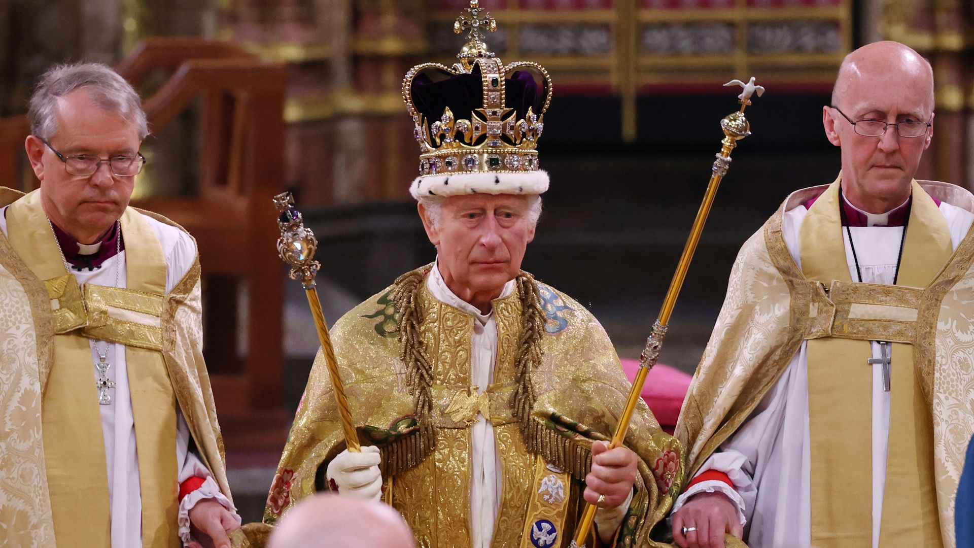  King Charles III stands after being crowned during his coronation ceremony in Westminster Abbey