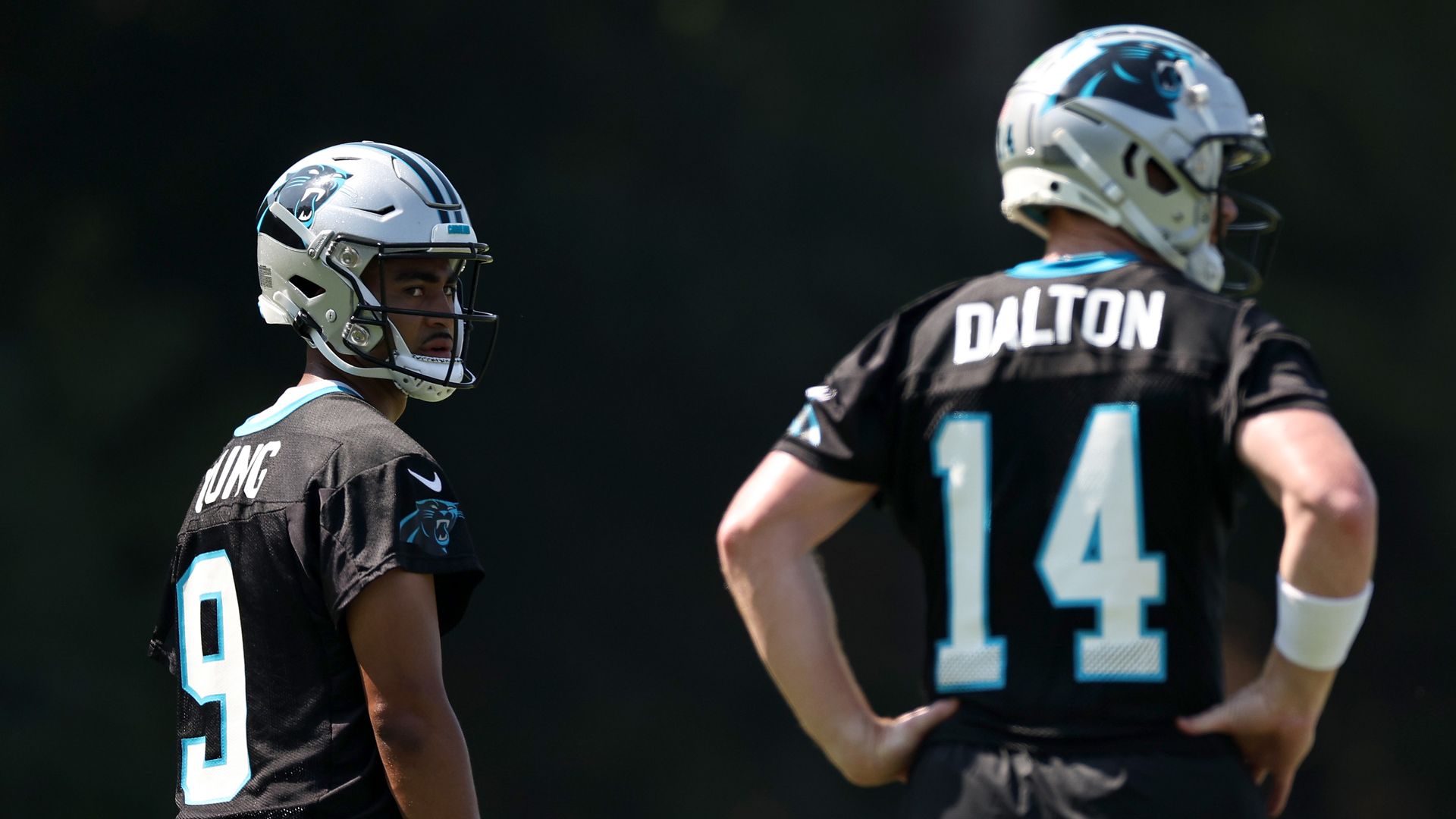  Bryce Young #9 and Andy Dalton #14 of the Carolina Panthers look on during Carolina Panthers Training Camp at Wofford College on July 27, 2023 in Spartanburg, South Carolina. (Photo by Jared C. Tilton/Getty Images)