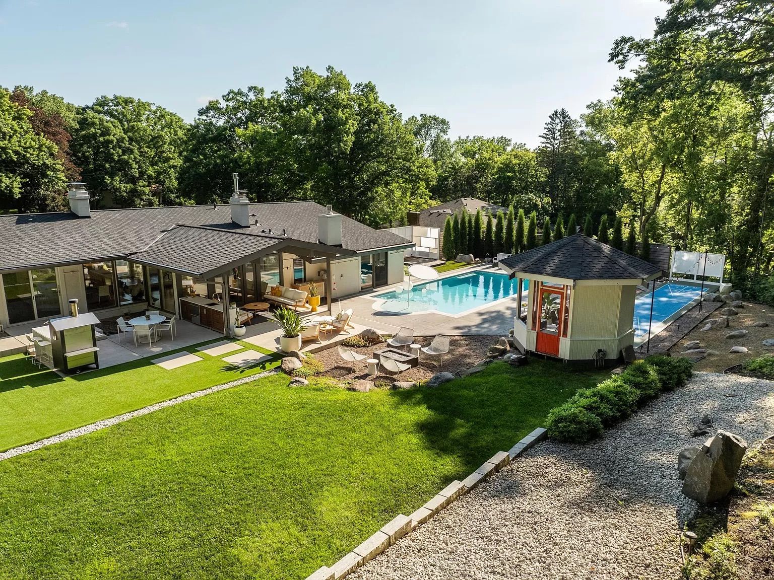 An overhead shot of a mid-century modern home with a pool.